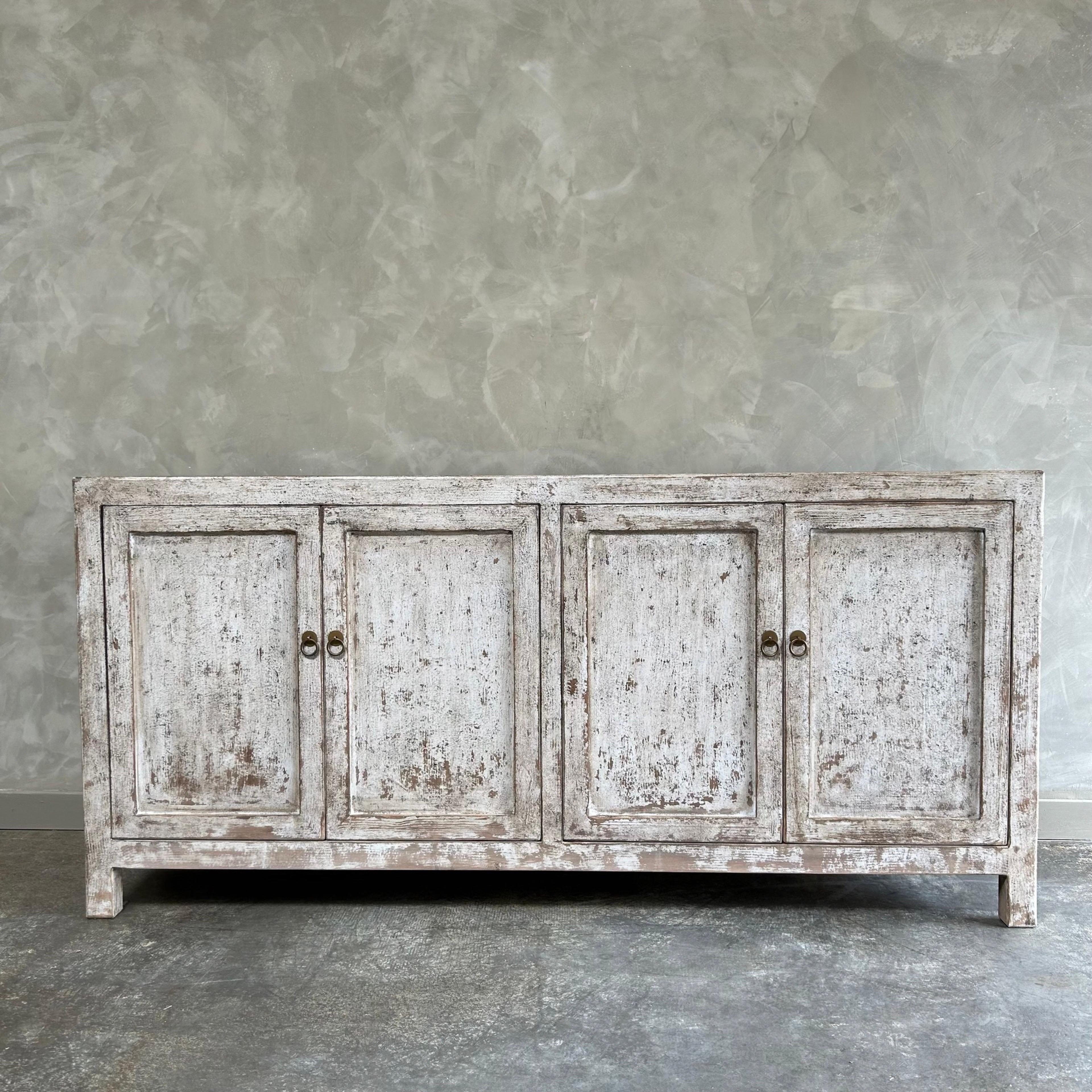 distressed white wood cabinet