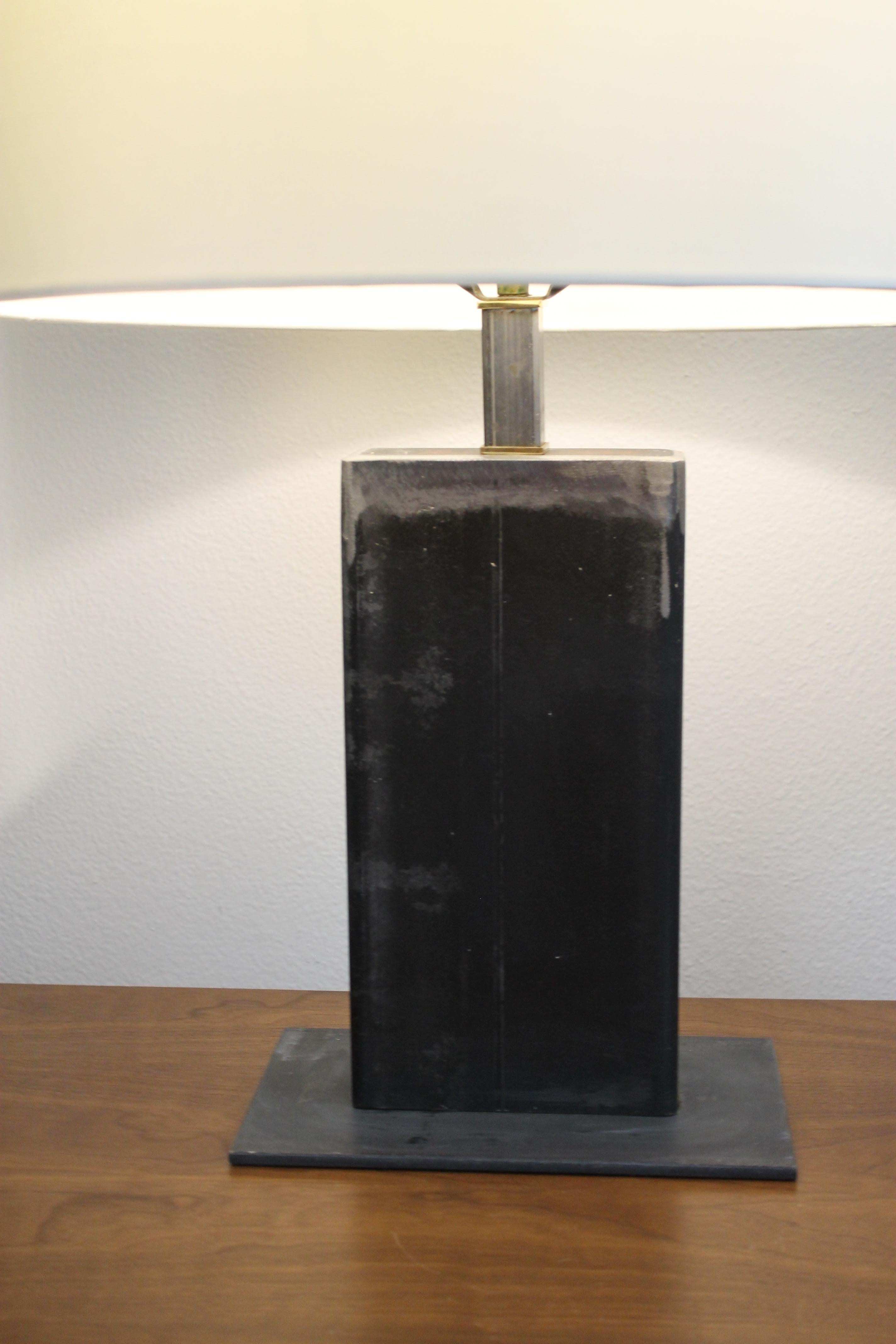 Contemporary studio designed rectangular steel table lamp. We left the lamp in its raw unpolished state. We have 3 table lamps listed and this is the smallest size. Base is 10