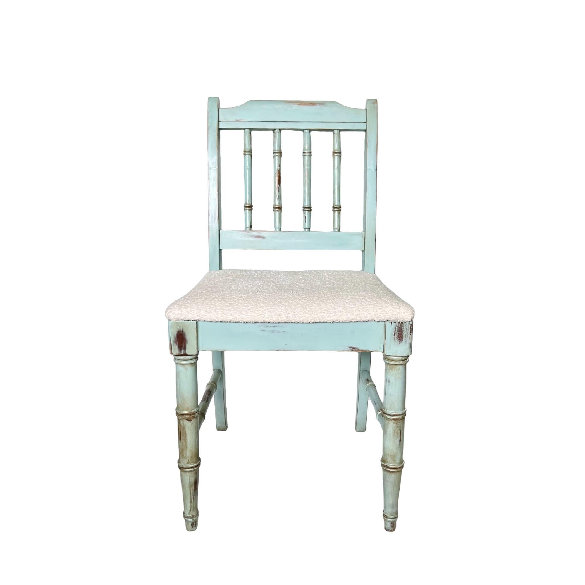 This vintage 1970's Palm Beach Regency faux bamboo small side or vanity chair by Dixie has been custom refinished in distressed (original dark wood shows through in places) satin light dusty blue with dark wax details and pearlescent highlights. It