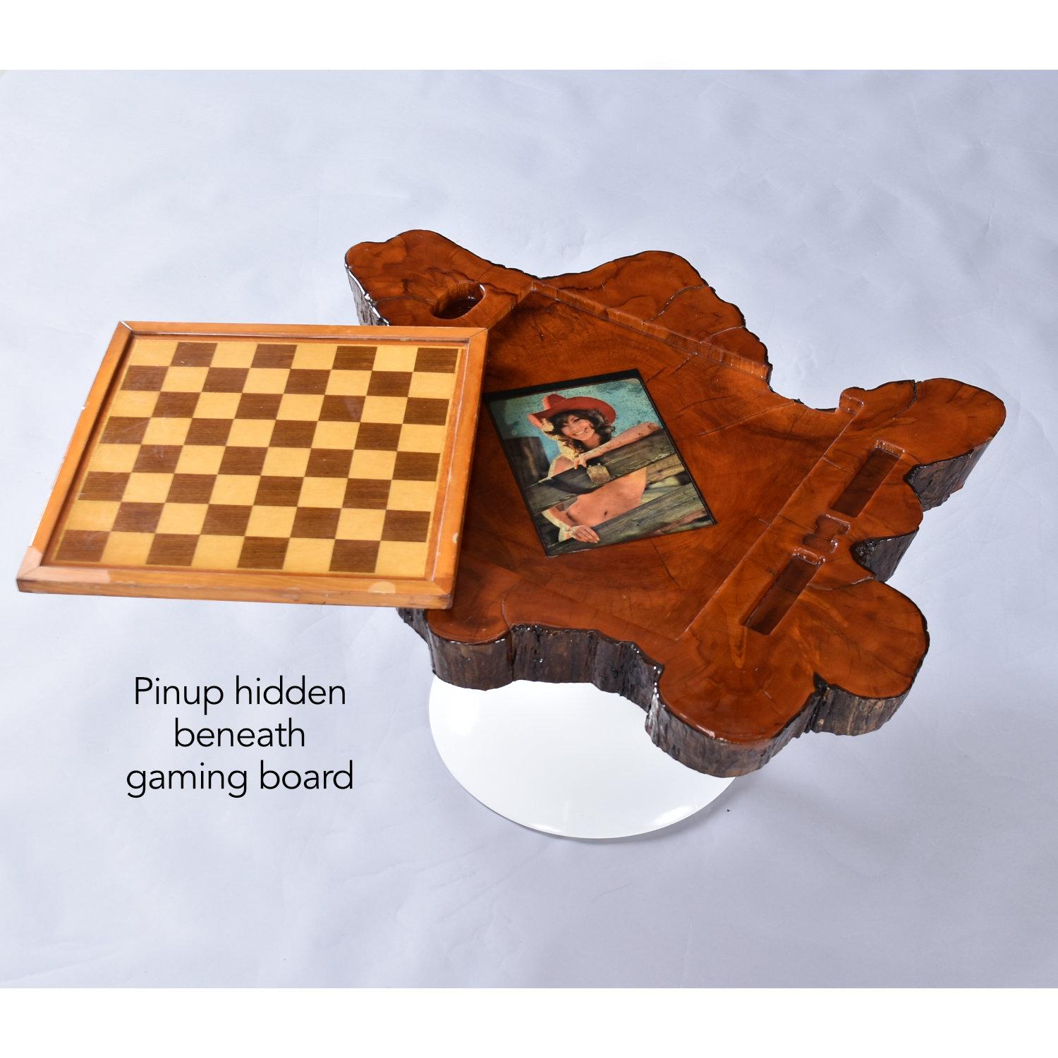 Vintage live edge wood, reversible chess and backgammon gaming table. A reversible game board is inset to the slab. One side for backgammon, flip to reveal a chess or checkerboard. Gullies along the side for storing game pieces. The gaming table is