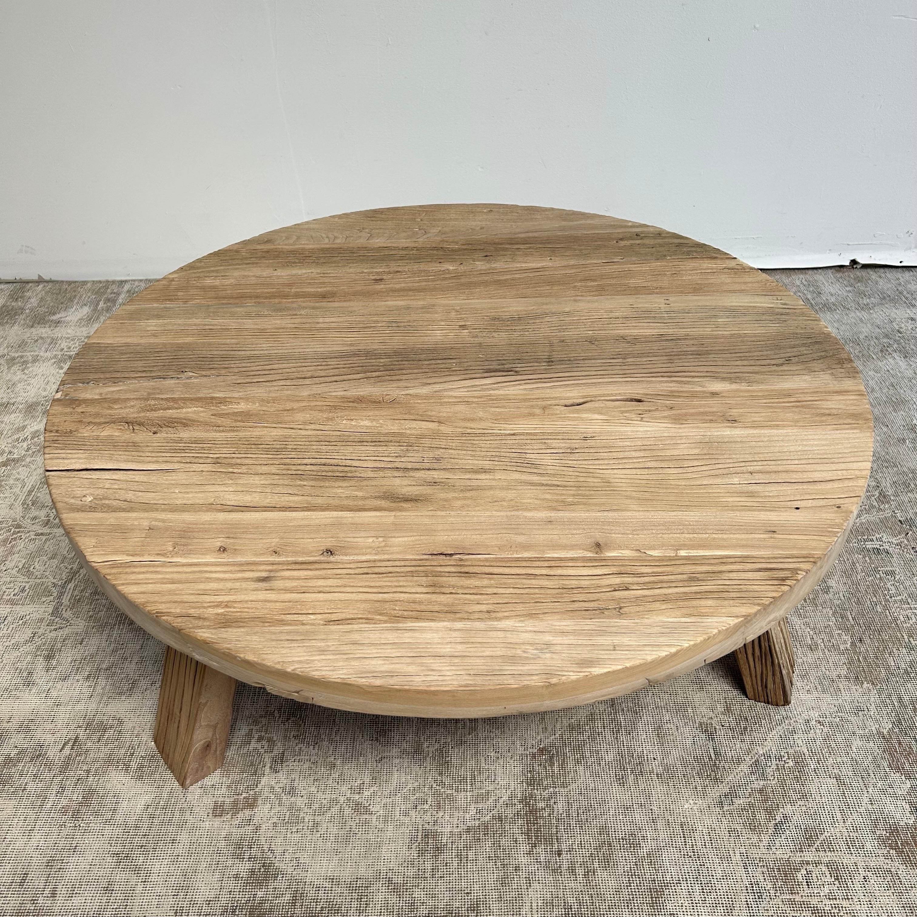 Custom made by bloom home inc elm wood round coffee table with approximately 2? thick top. Solid elm table is heavy, sturdy, ready for everyday use. Medium elm wood waxed finish. We currenlty have these in stock please view quantity availability