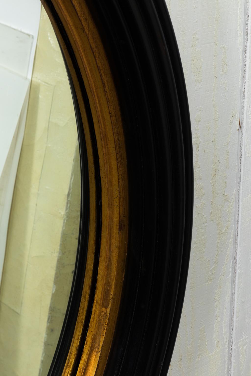 round black and gold mirror