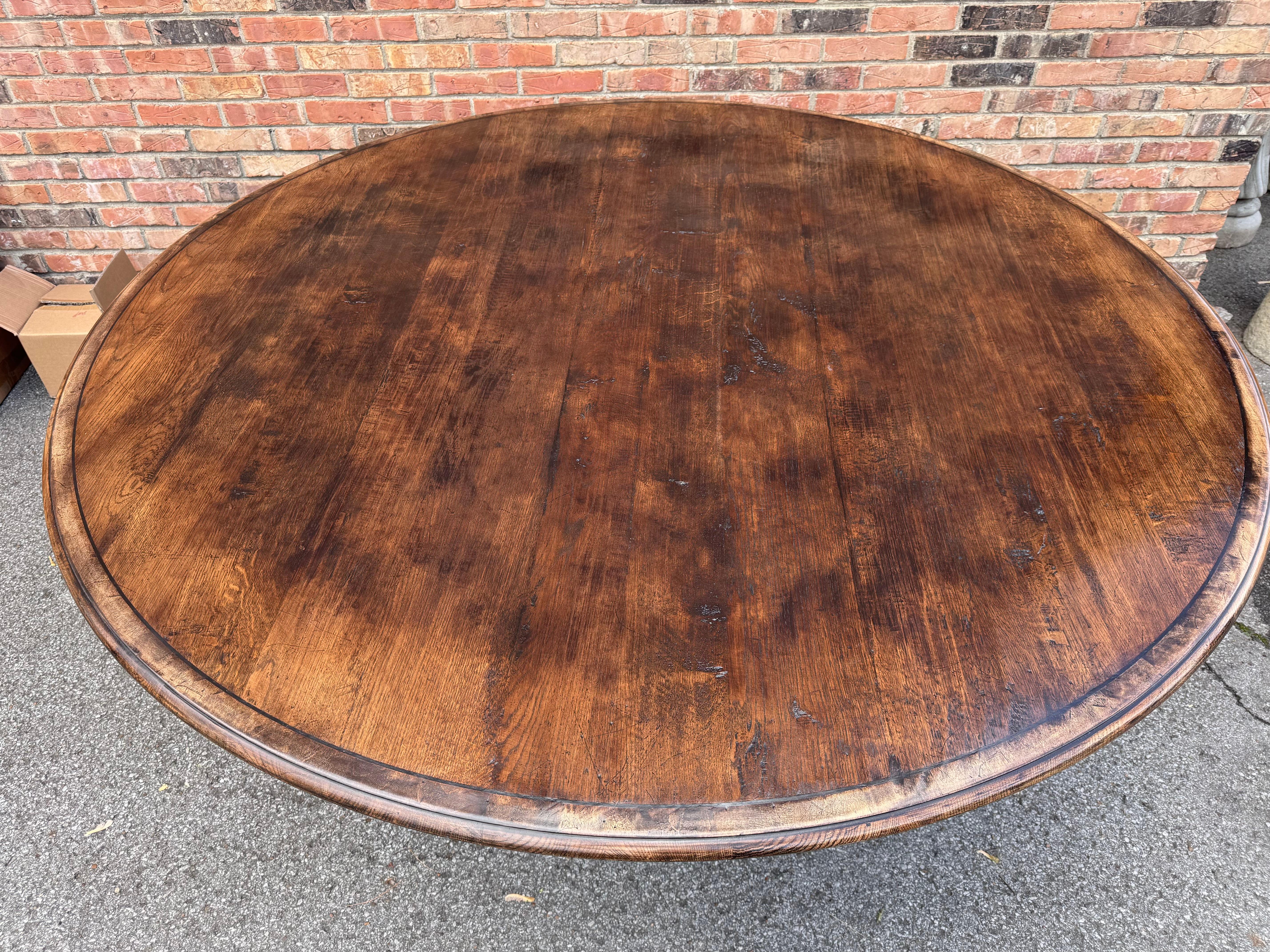 This is a beautiful custom-made dining table from England! The wood has lovely natural designs and is a gorgeous warm tone. Very simple, yet elegant design with round top and pedestal base. This table would make an excellent addition to your dining