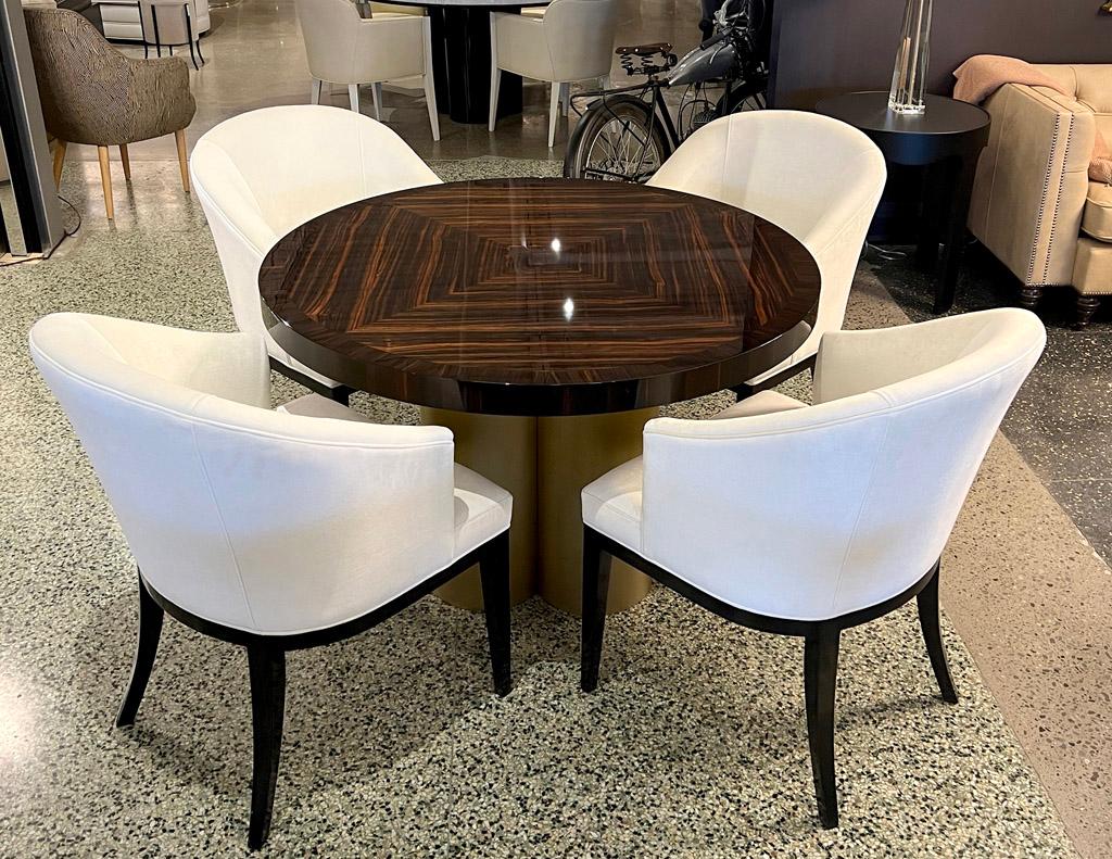 This stunning, hand-crafted round custom Macassar table from Carrocel is an absolute show-stopper. The unique Macassar wood grain diamond pattern top is sure to make a statement in any home. It is hand-polished and coated in a high gloss lacquered