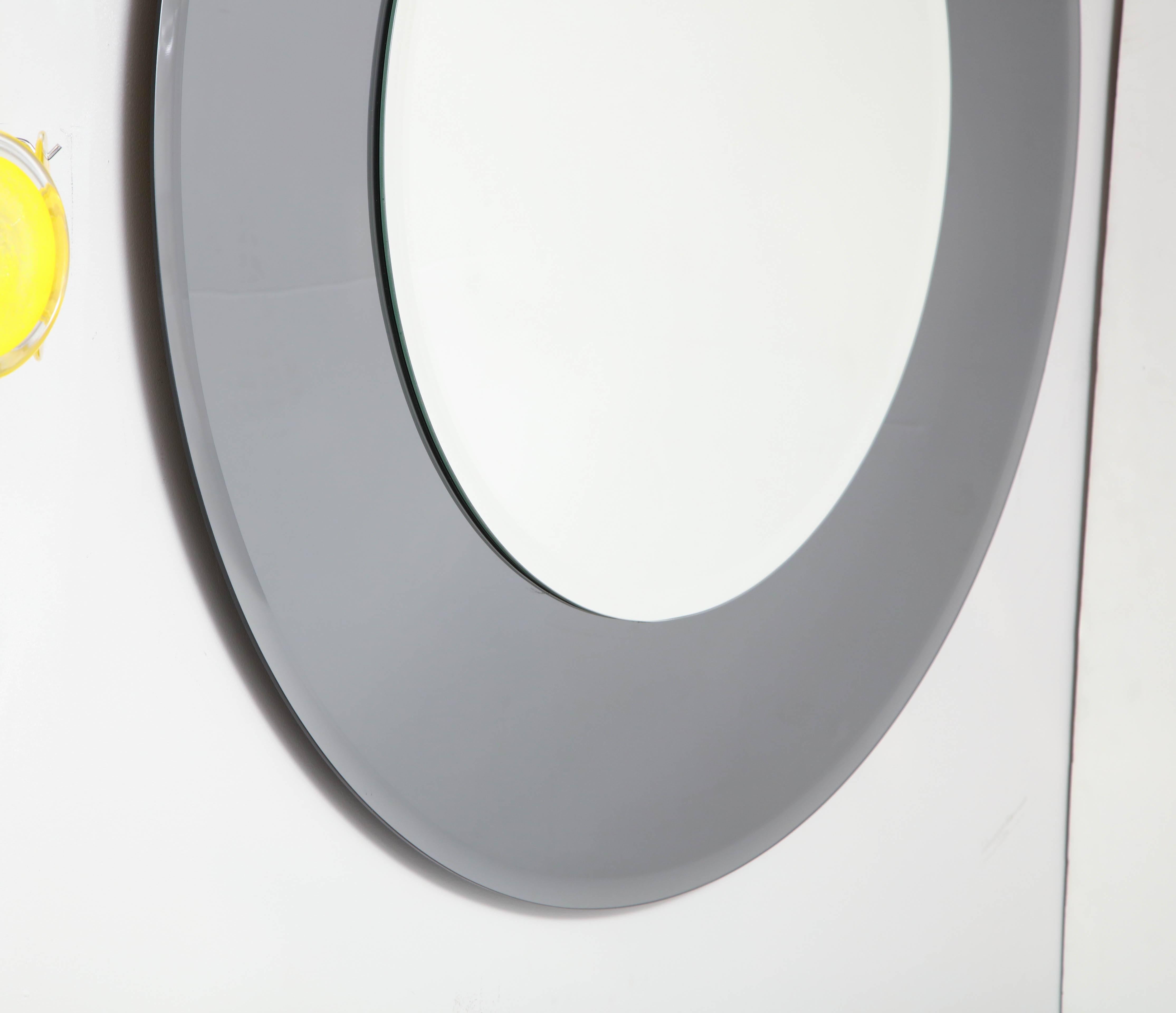 Custom large beveled edge round mirror with smoke glass border. The center mirror is 30