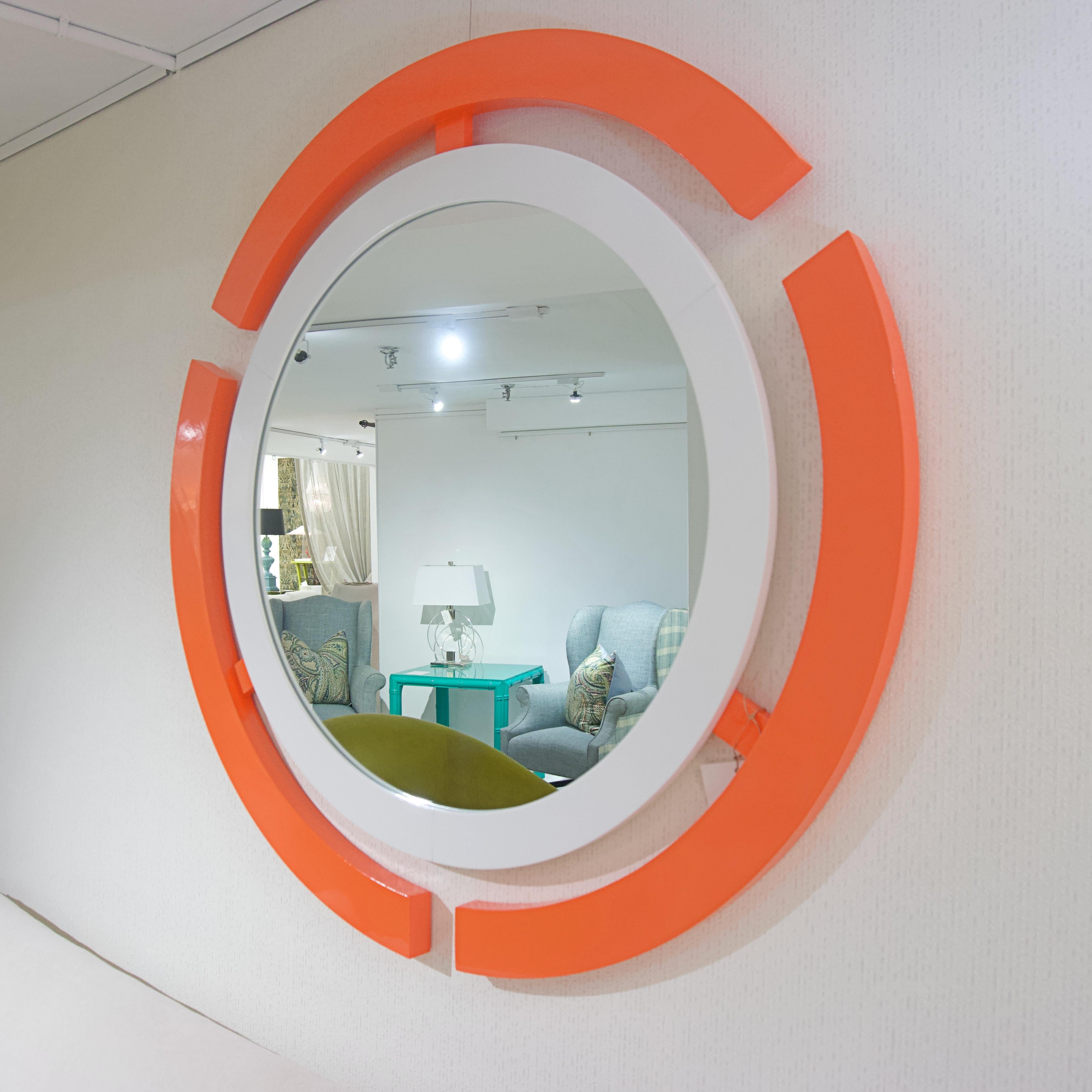 Customize this mirror with any color or buy as is in orange and white lacquer. Inspired by sci-films. Made with poplar wood and marine lacquer. 

Dimensions: 43” round.
