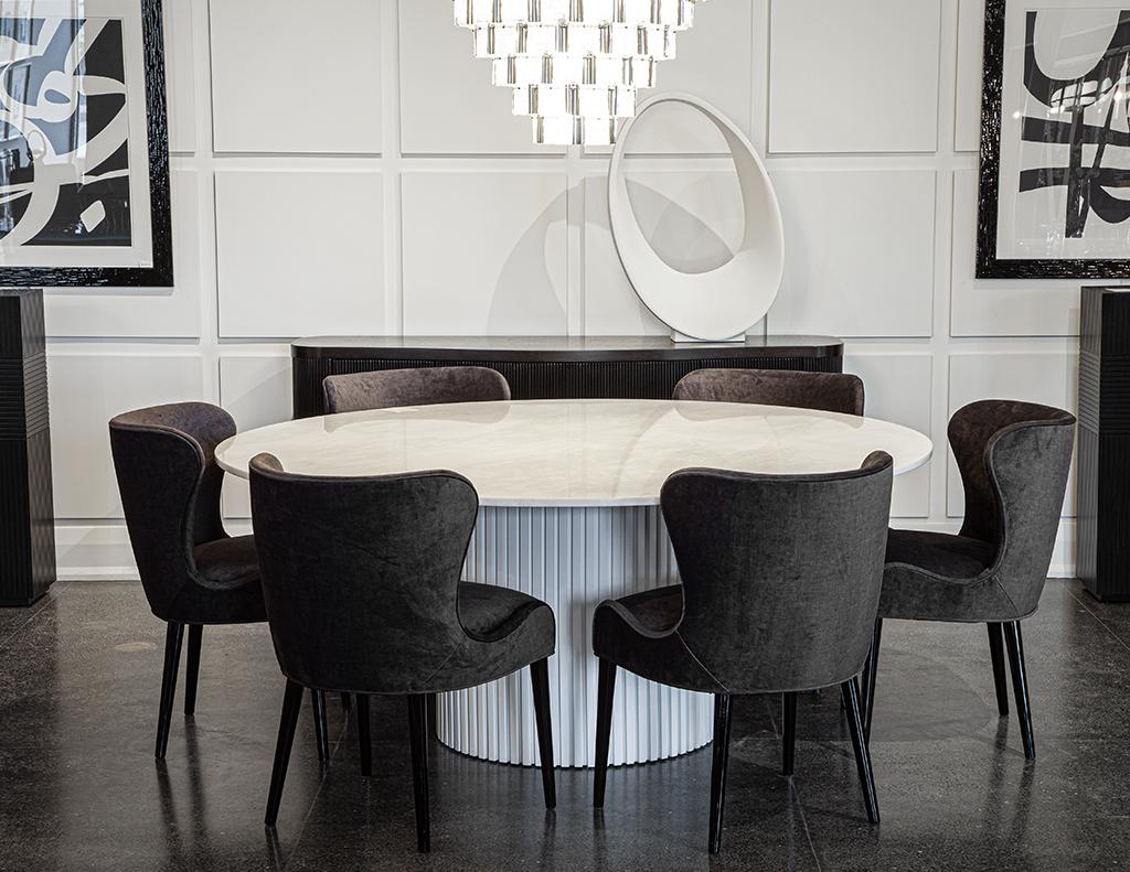 Custom round white marble-top dining table. Featuring beautiful marble-top with smooth edge and uniquely modern designed wood pedestal base.
All hand crafted and custom made to order here in North America.

Listing is for table with pedestal only.