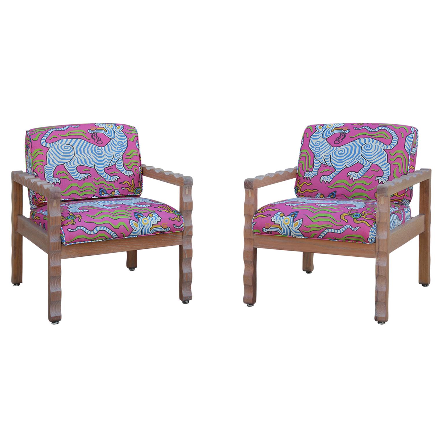 Postmodern style custom lounge chairs with Pierre Frey fabric. The frames are made from solid oak and have a scalloped shape on the arms and legs.