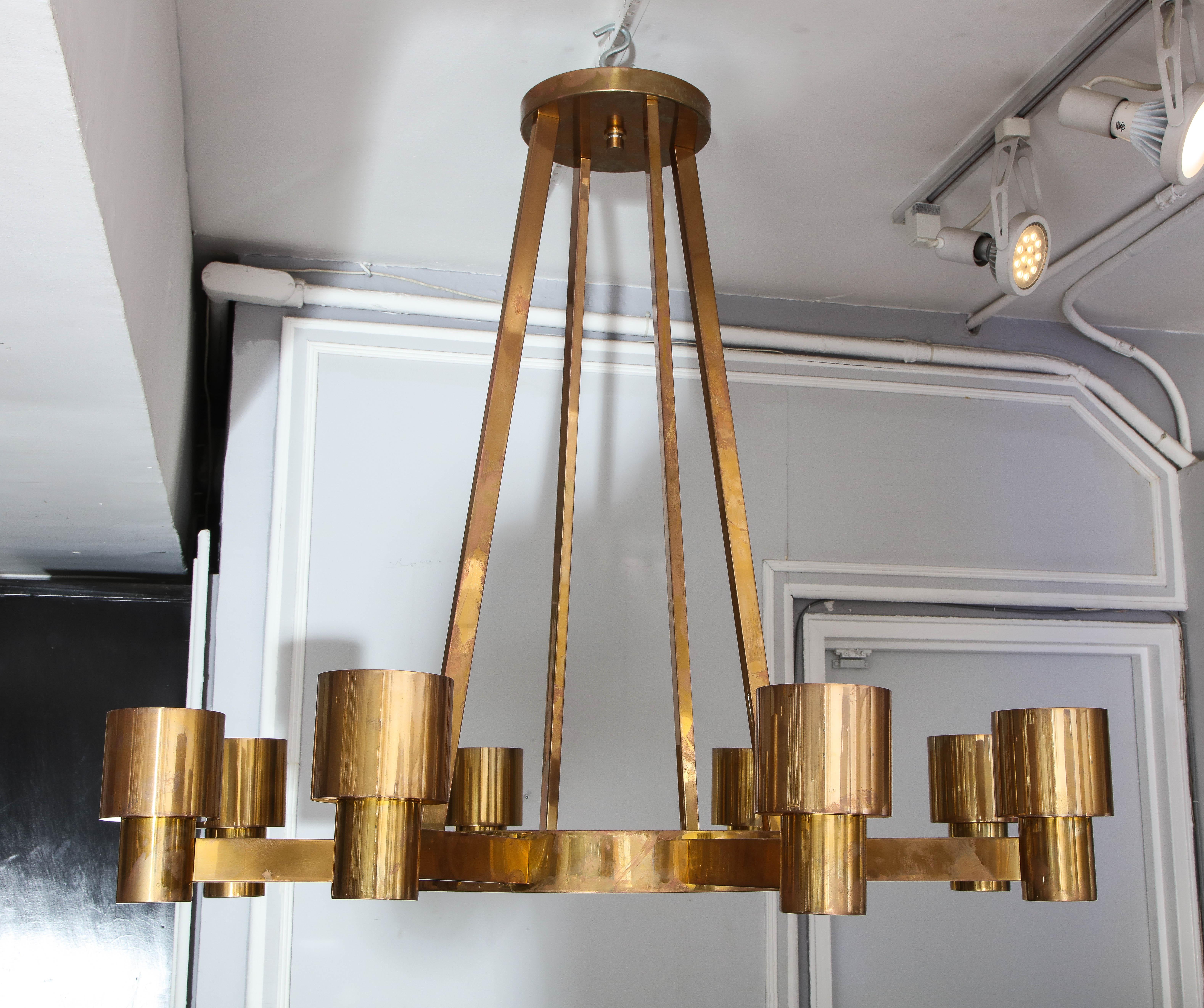Custom sculptural brass chandelier with eight arms.
This chandelier is custom made. The turnaround time is 8-10 weeks.