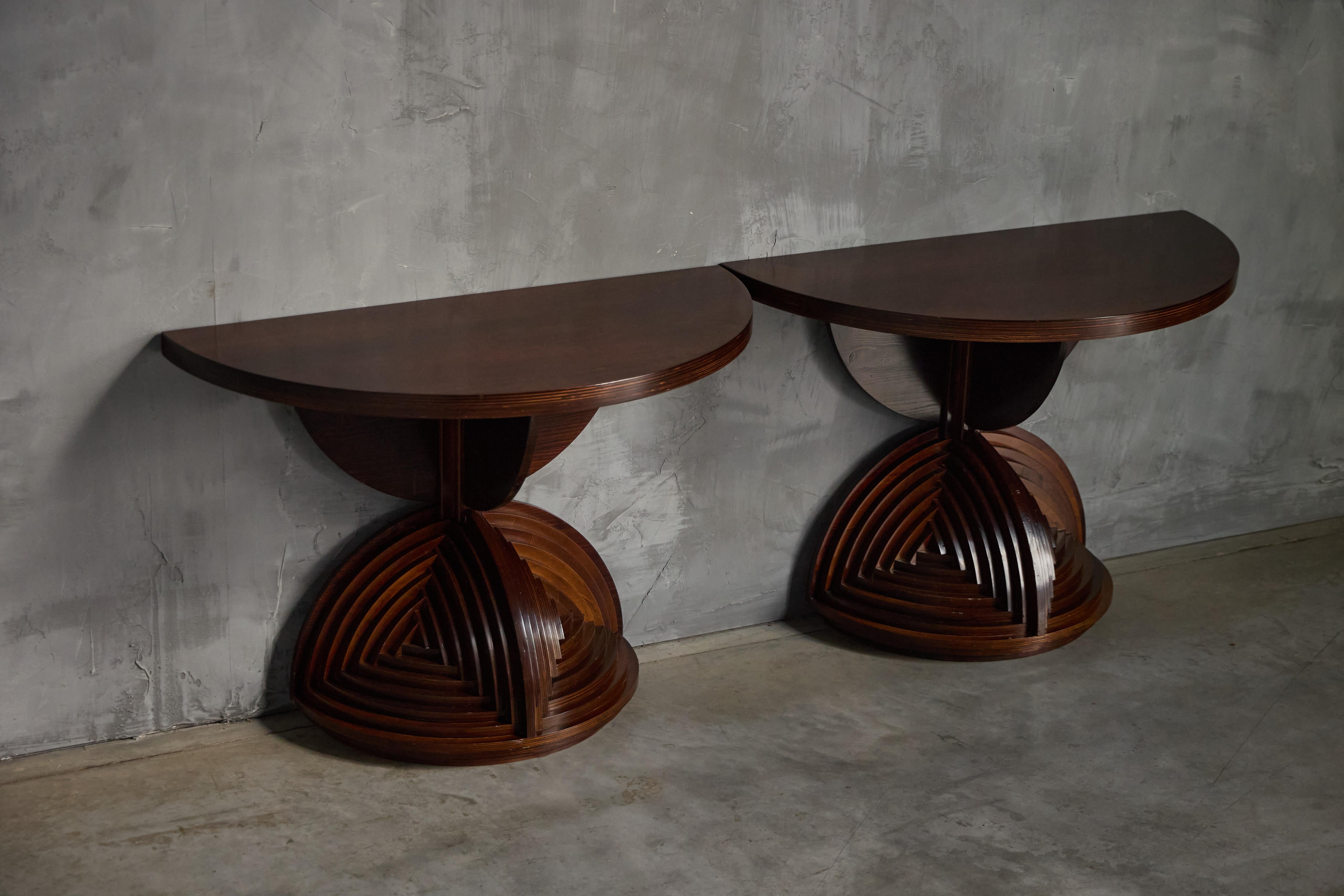 A rare custom-made console table by Italian artist Mario Ceroli, created in the 1970s. Crafted entirely from wood, this sculptural piece showcases Ceroli’s expressive, architectural language. The base features a bold composition of layered arches,