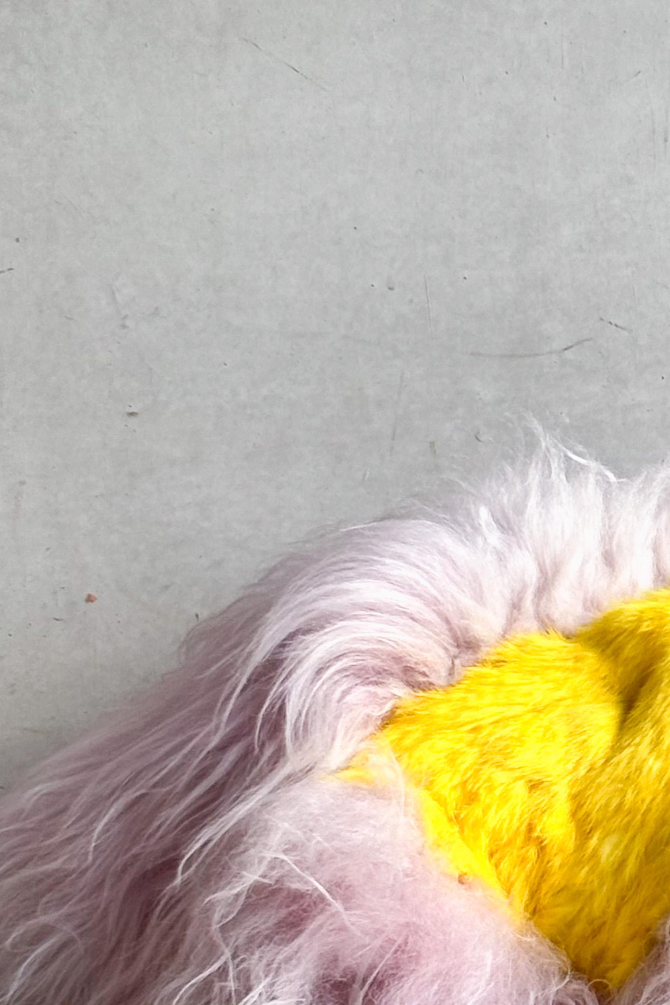 This unique pink and yellow sheepskin pouf by Belgian artist Carine Boxy, embodies her signature approach to craftsmanship and natural materials. Handcrafted from naturally dyed sheepskin, each piece is one of a kind, offering a rich texture and