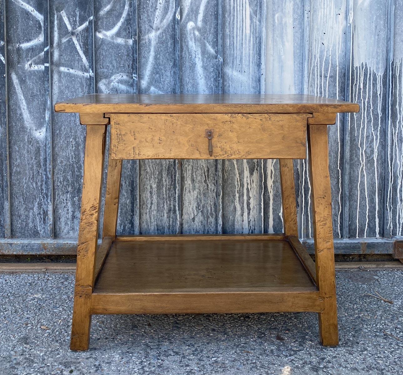 Custom side table or nightstand with drawer. Can be made ion any size and finish. Shown here with a heavy distress and our Walnut #1. Our pieces are bench made from solid wood and hand finished in Los Angeles. The lead time is 16 weeks. 
Please