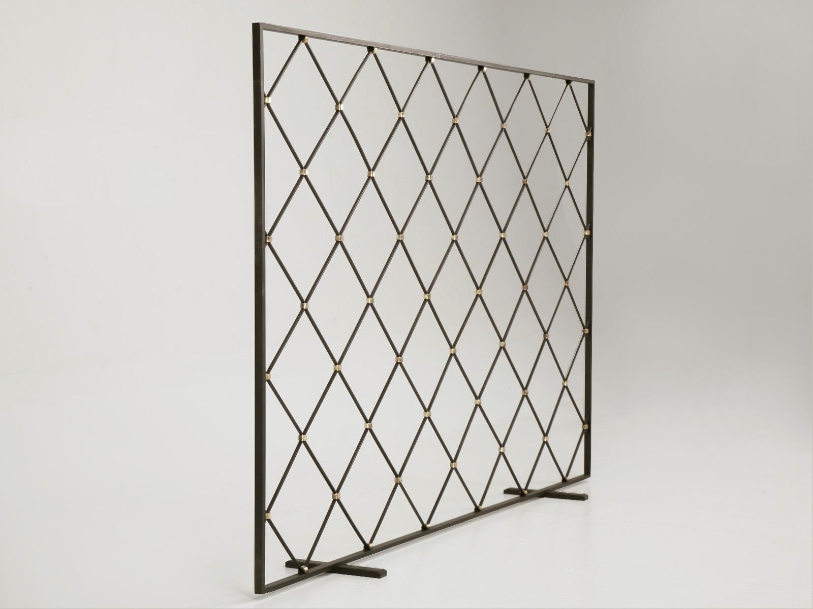 Mid Century Modern Custom designed Steel Fireplace Screen with Brass Fittings made in our Old Plank Workshop. This style is very indicative of French 40's as well as Art Deco. We can reproduce this screen in custom sizes, shapes, or colors. Make it