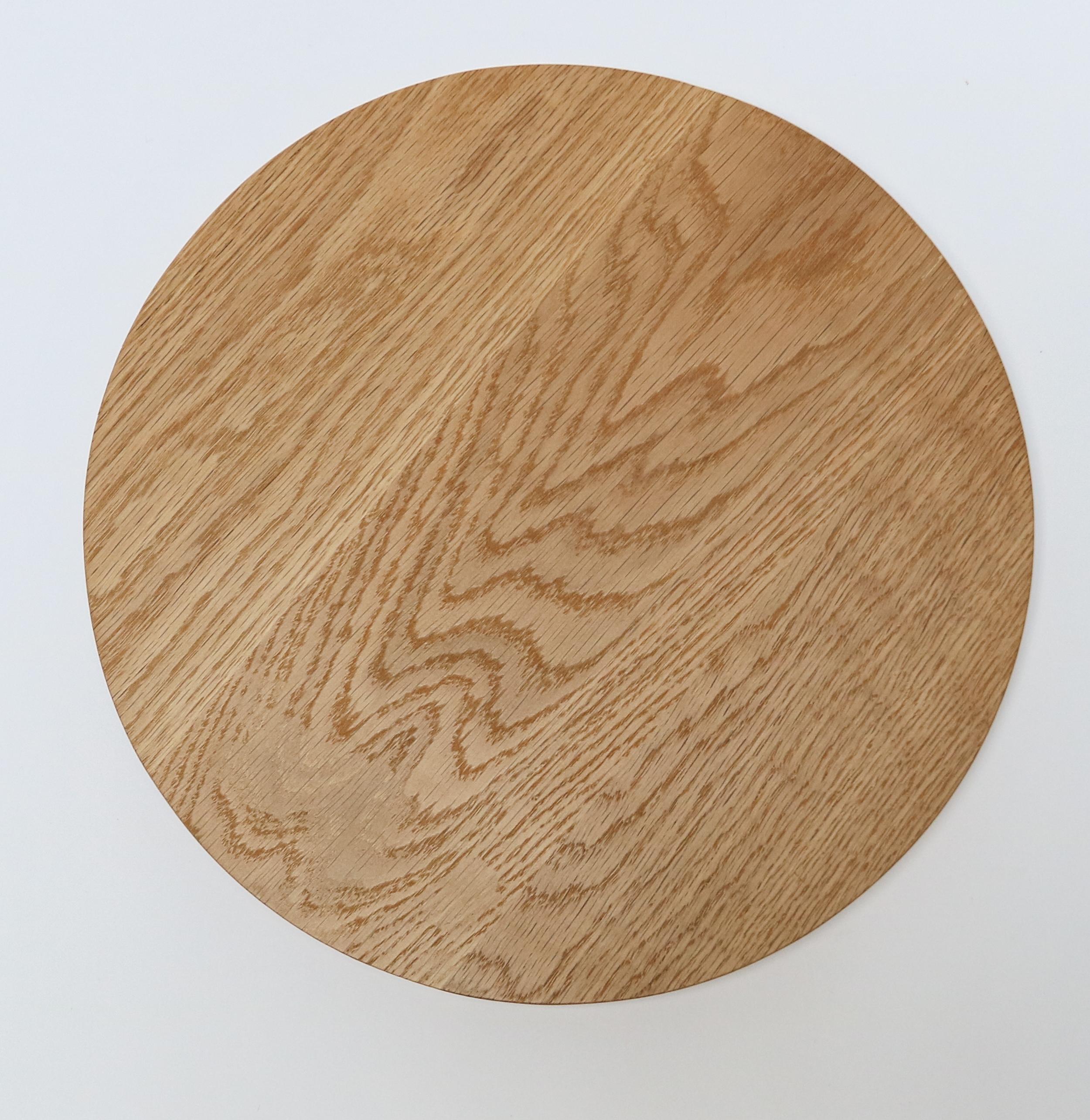 Custom small round serving board in oak by Adesso Imports. Can be done in different sizes and woods.