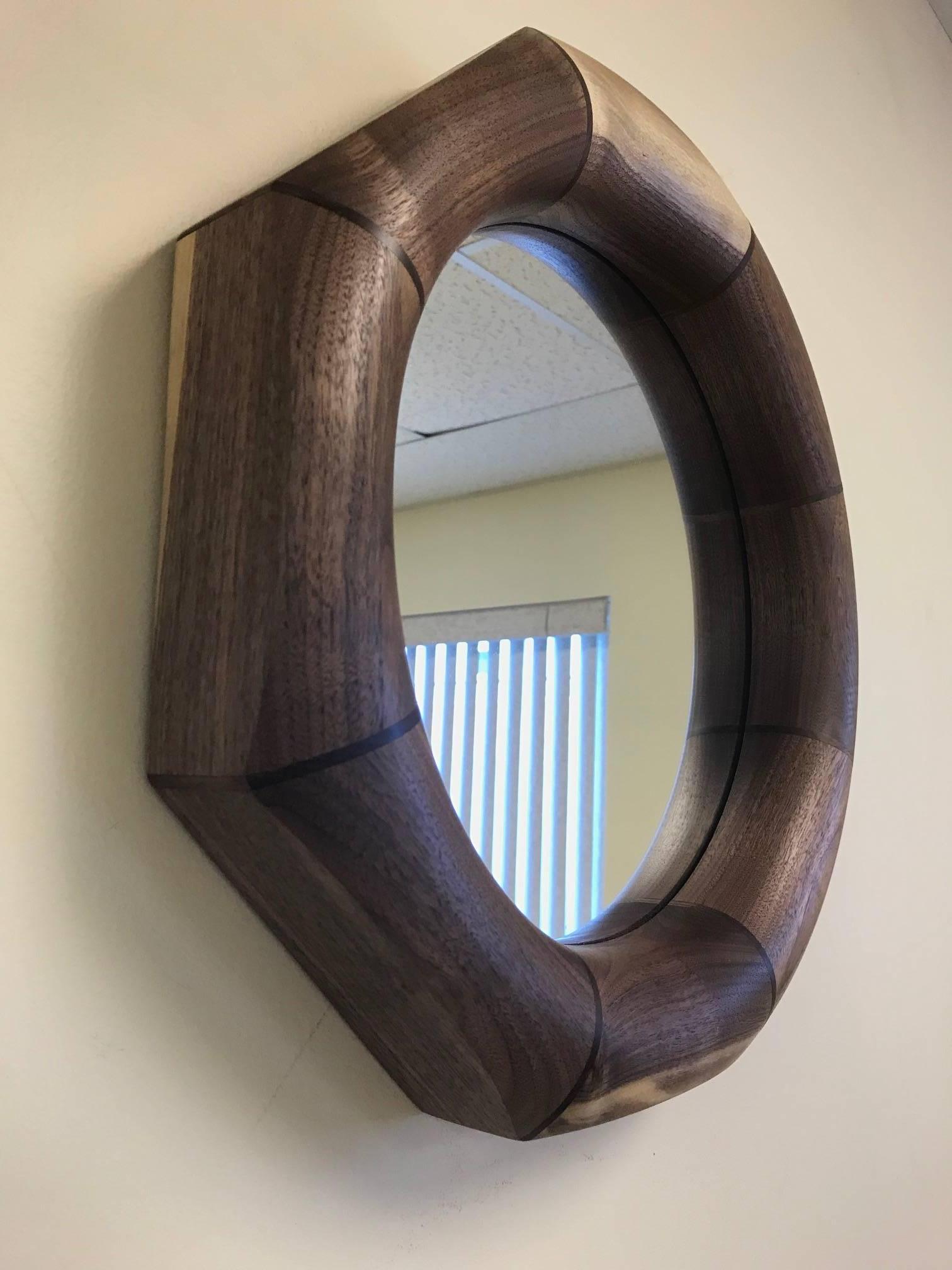 Custom solid walnut mirror with an octagonal shape.
The mirror listed is currently available.