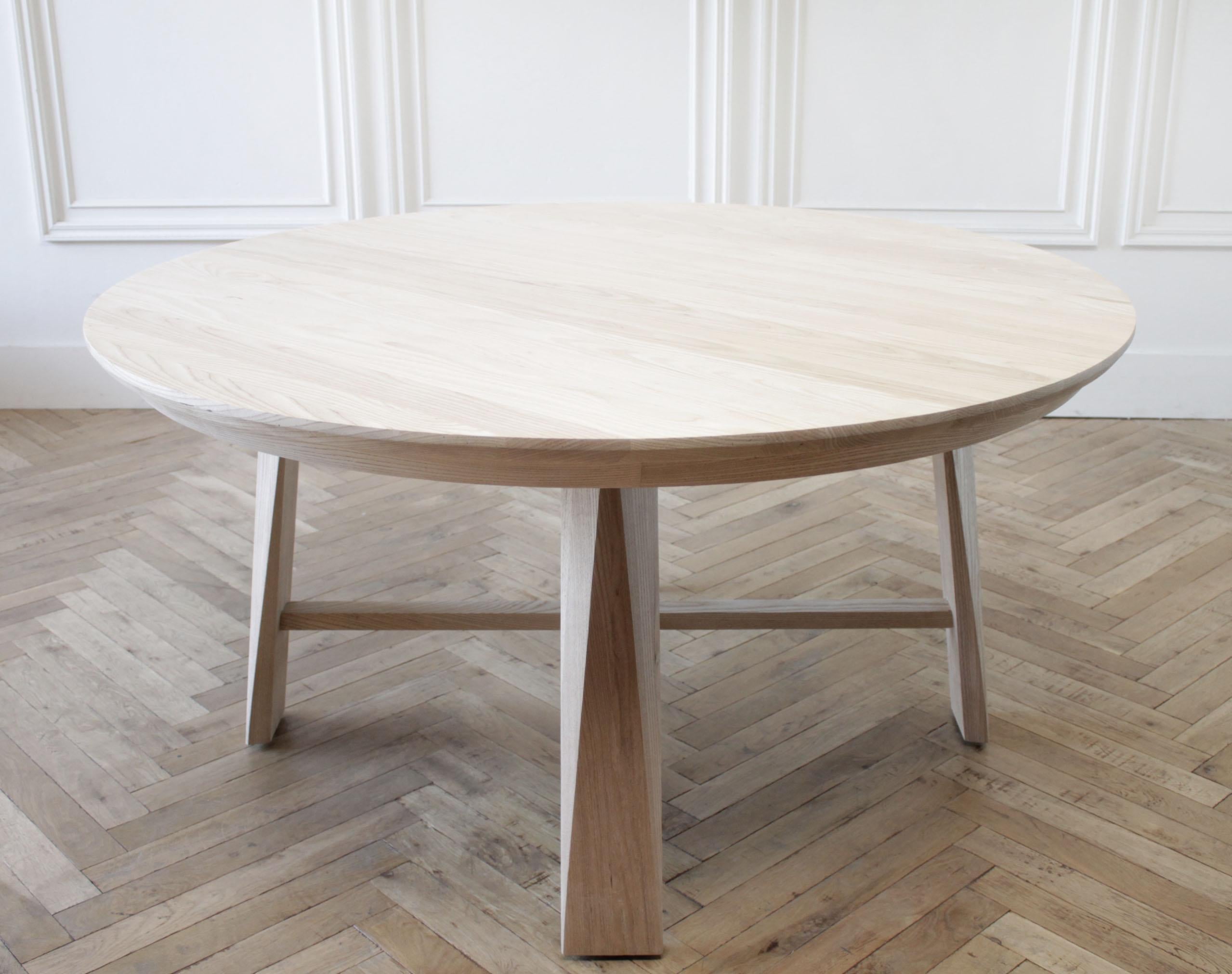 Custom solid white oak round dining table
Available for custom ordering, in any size, shown in waxed white oak.
We also offer a natural white oak, medium white oak, and onyx stain. Beautiful angular cut legs with stretcher. Tabletop can be removed