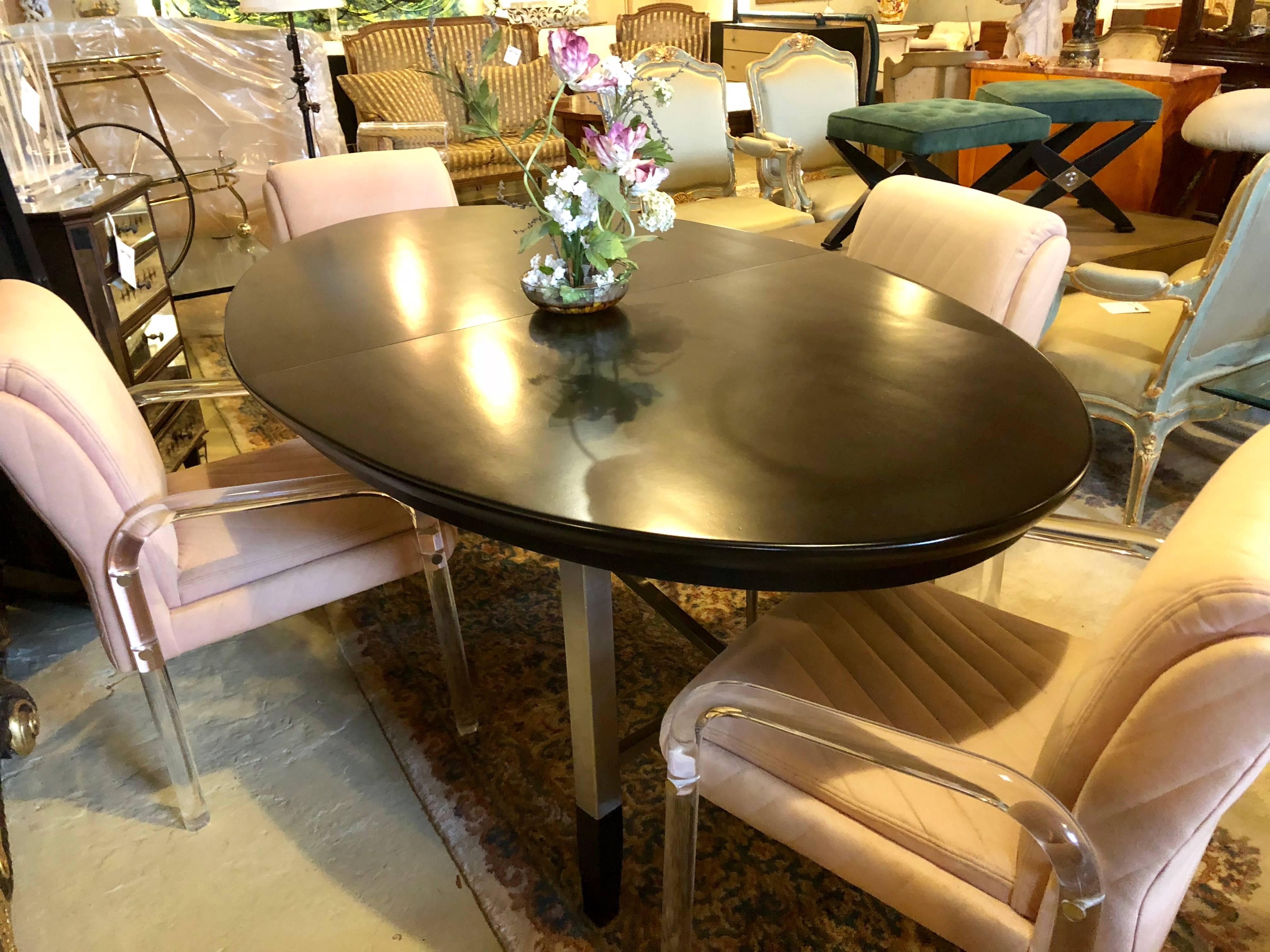 Mid-Century Modern Custom Steel and Ebony Oval Design Dining Table Having Two Hide-Away Leaves