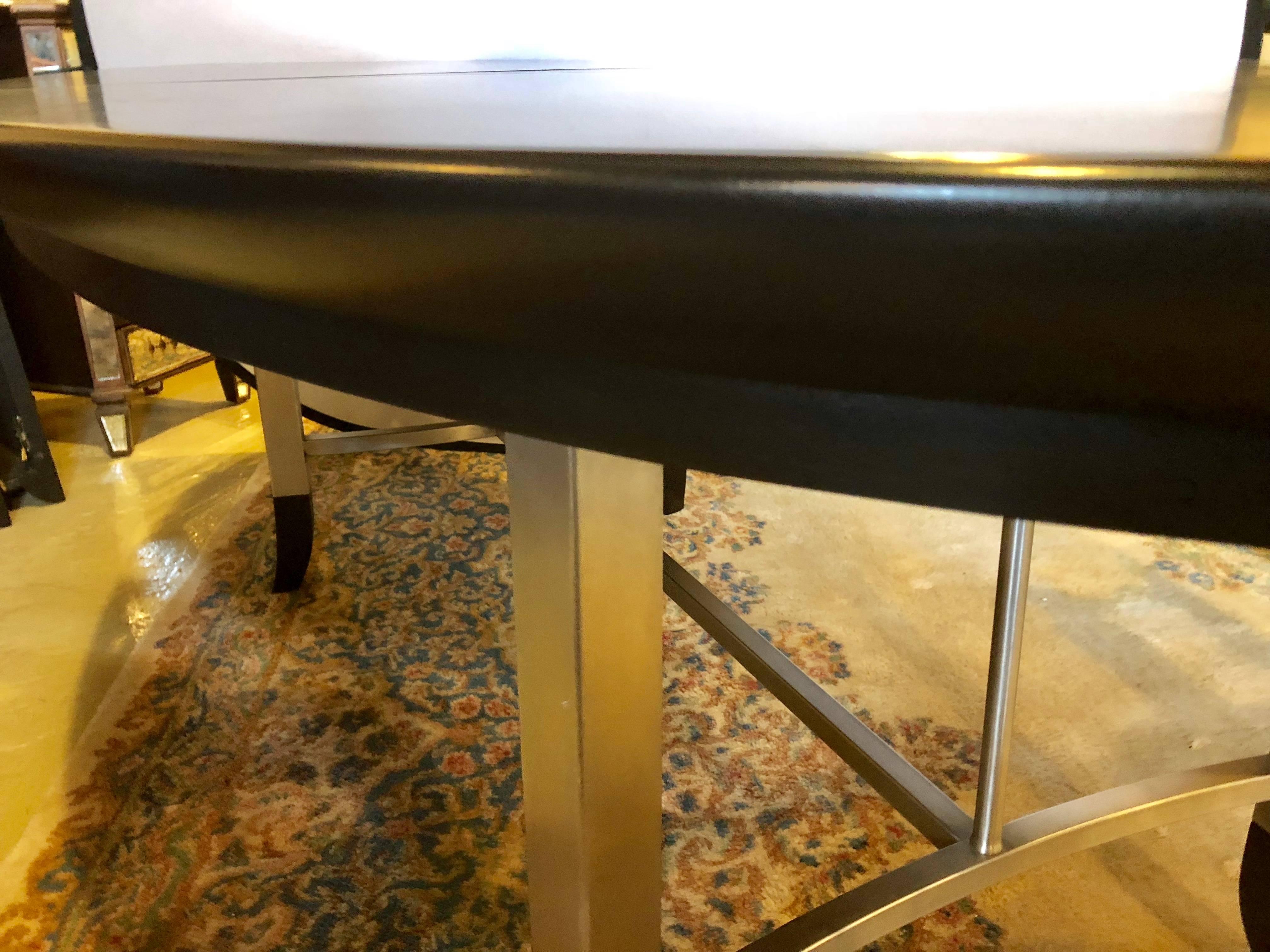 20th Century Custom Steel and Ebony Oval Design Dining Table Having Two Hide-Away Leaves