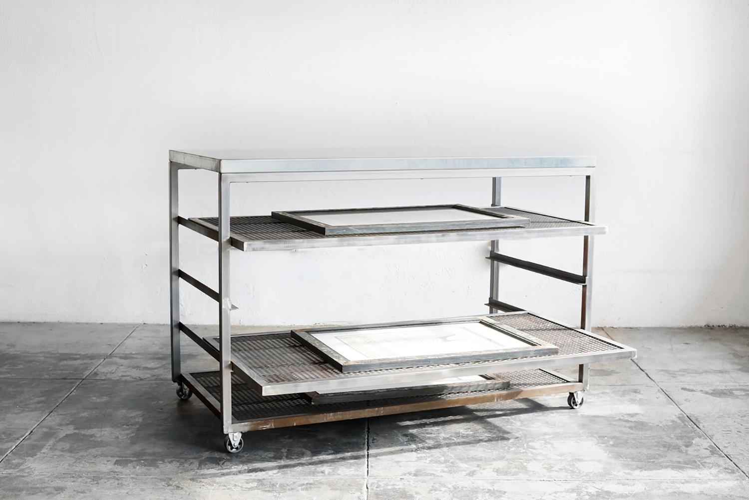 Our custom-made steel rolling rack features expanded metal (mesh) shelves and a galvanized top. Excellent in a printer/artist studio, modern kitchen or industrial space of any kind. Coated surface designed to oxidize over time and reveal light