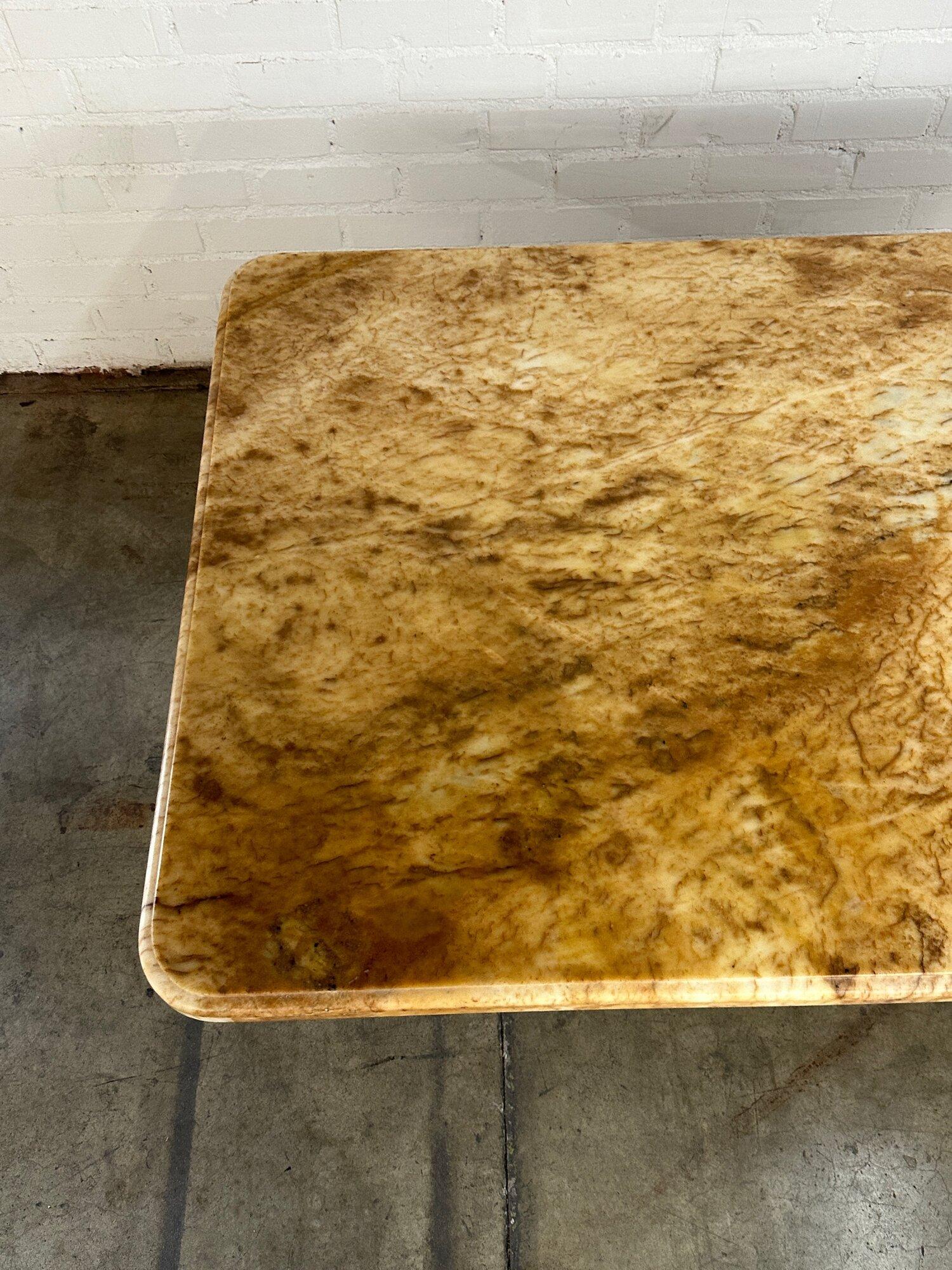W64 D41 H30.5

Newly restored custom dining table. Item feature stone that seems to be alabaster in excellent conditon with no visible breaks or chips. Surface sits on a cusotm angular wooden base that has been refinished in a medium walnut. Surface