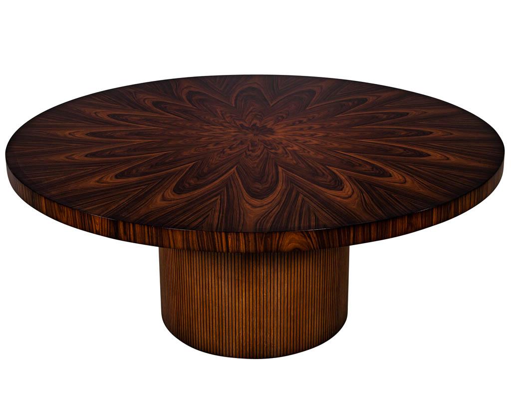 Custom sunburst modern round dining table. Featuring beautiful sunburst patterned top with round fluted base.

Price includes complimentary scheduled curb side delivery service to the continental USA.