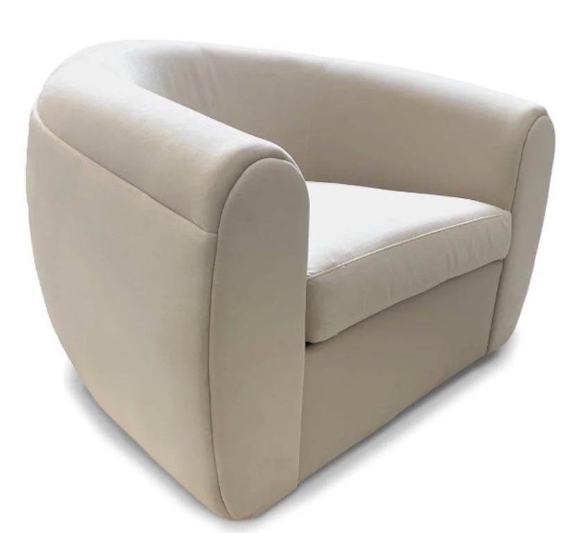 Our custom swivel chair is meticulously crafted to redefine luxury seating. Inspired by mid-century design, its sculptural shape offers a contemporary twist on the traditional lounge chair for a  modern sophistication. Plush, softly upholstered
