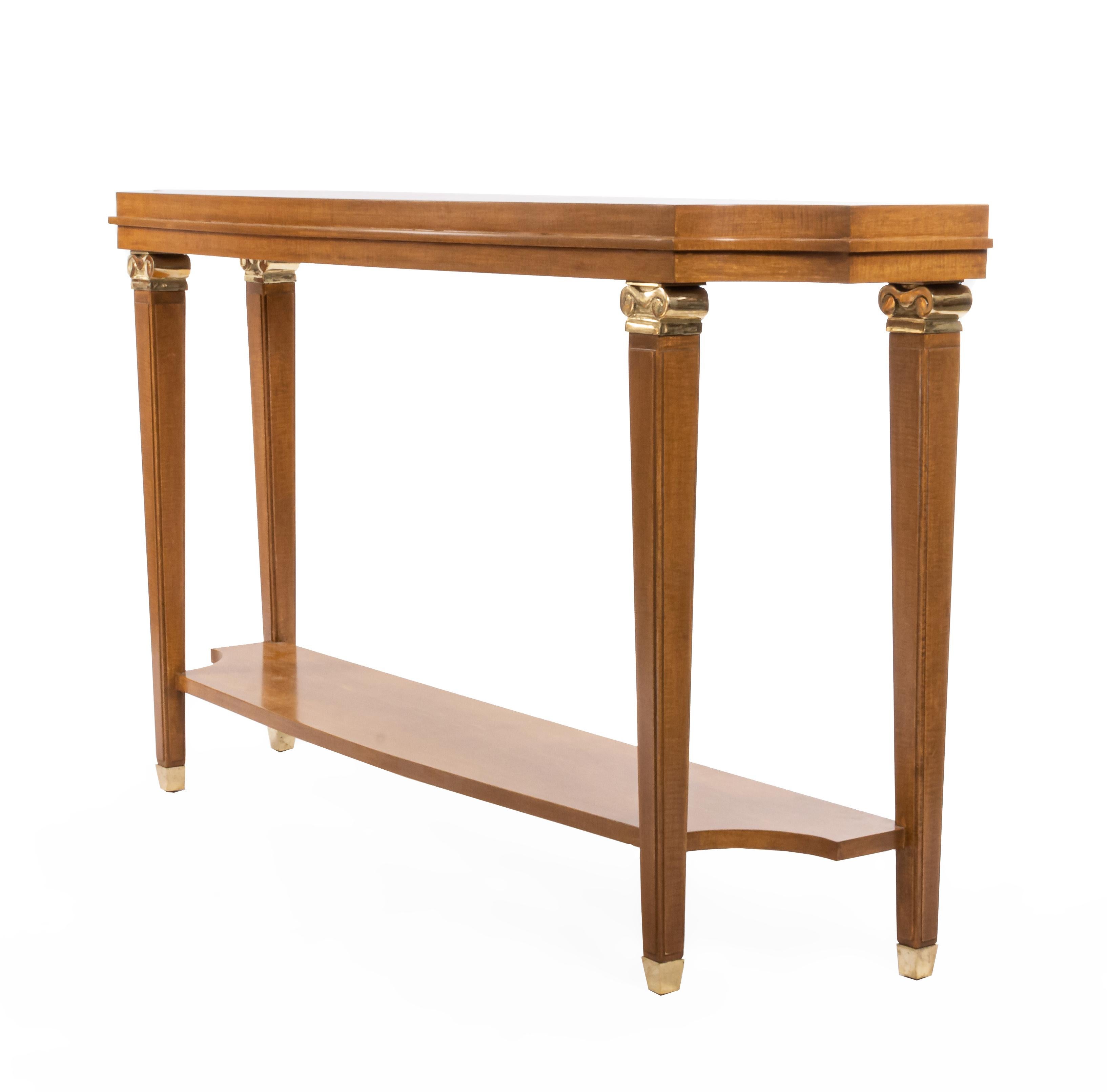 French 1940s Lucien Rollin-style sycamore shaped top console table with shelf and bronze capital trim on legs.