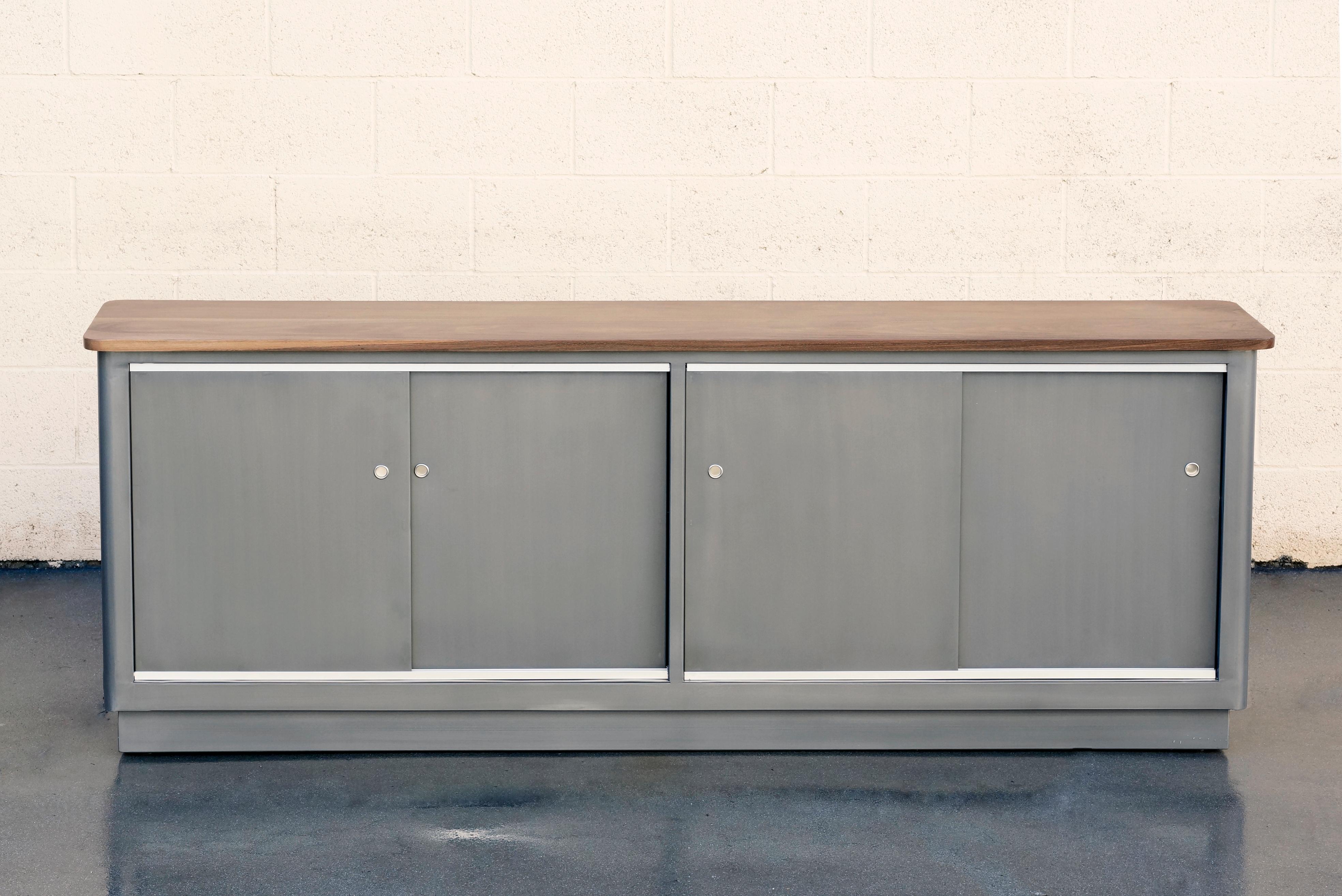 Custom made steel credenza with walnut top inspired by tanker style furniture popular in the 1960s. This beauty features a 