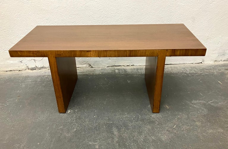 This simple walnut veneered table was part of a full-house interior custom-designed by Robsjohn-Gibbings on the UES in 1937-1938. Fully documented and with a letter from the family. Less ornate than most of the furniture from this project, Gibbings