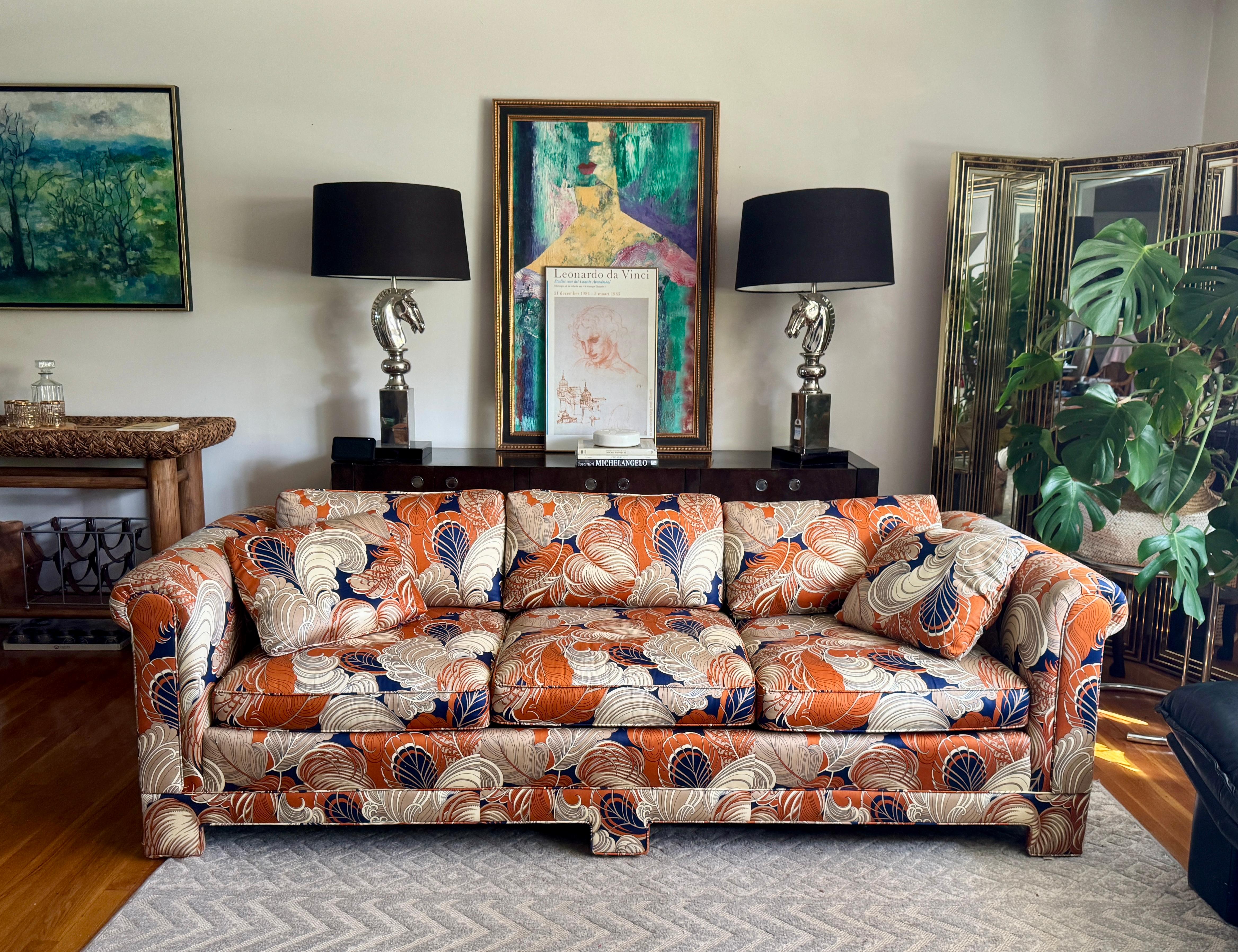 Exceptional custom sofa, commissioned and crafted in NYC. The construction is substantial and exacting, with a hardwood frame and masterful upholstery work throughout. Upholstered in a richly patterned composition of terracotta, indigo, and