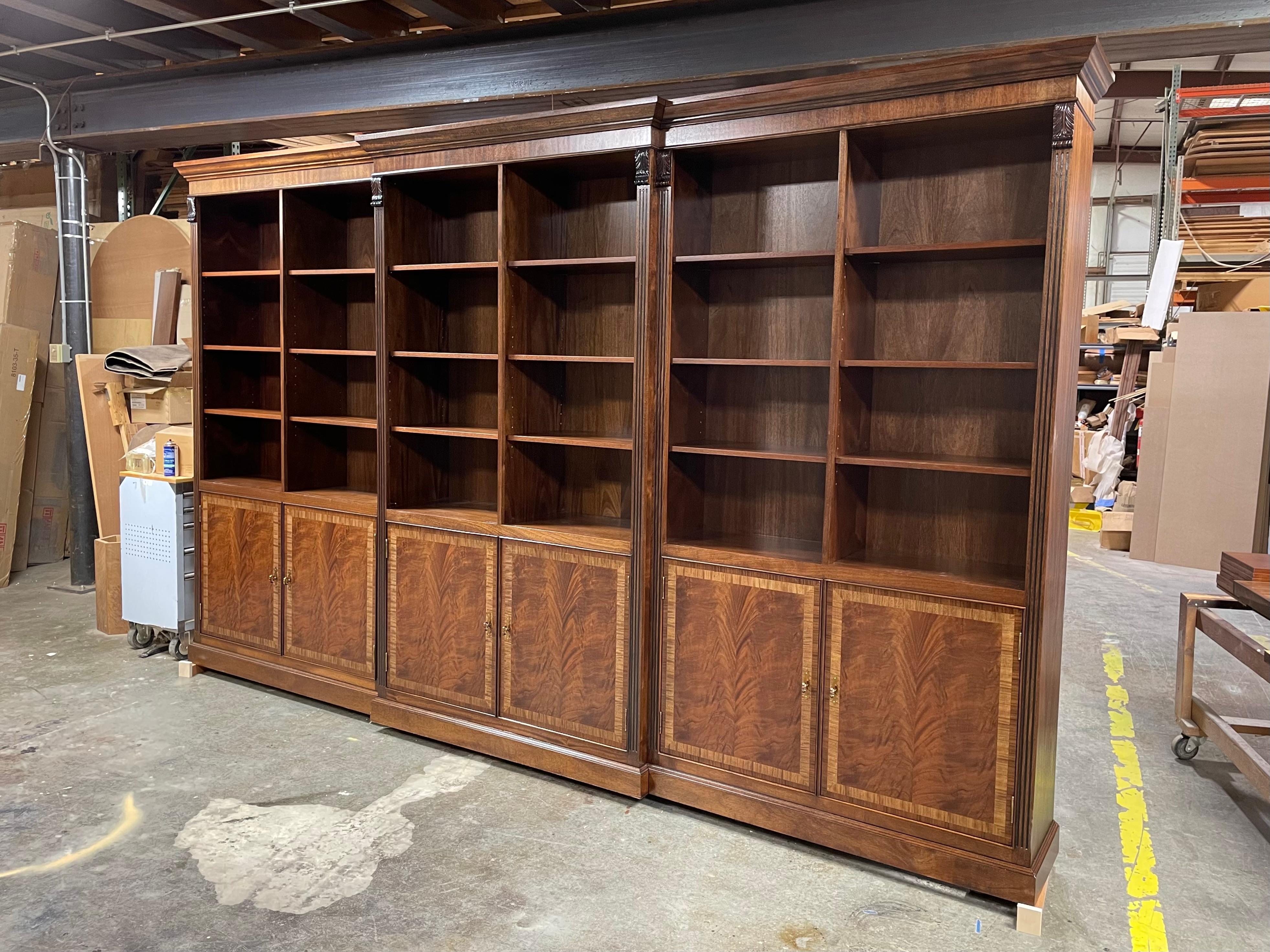This is a very large traditional mahogany Bookcase/Display Case made by Leighton Hall in its Suwanee, Georgia shop.  It is made-to-order and can be made to custom dimensions and specifications.  The estimated production time is six months.  It