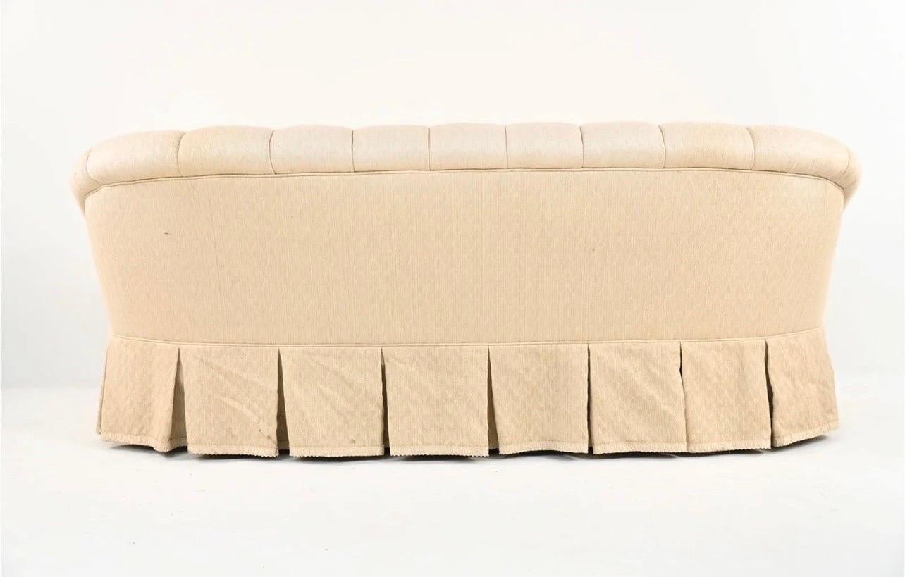 Elegant tufted custom chesterfield sofa upholstered in a neutral beige chevron woven fabric.  Features gorgeous tufting and skirted pleat 360 degrees.  Down filled cushions of course.  A beauty.  Very good shape with only small area of fabric