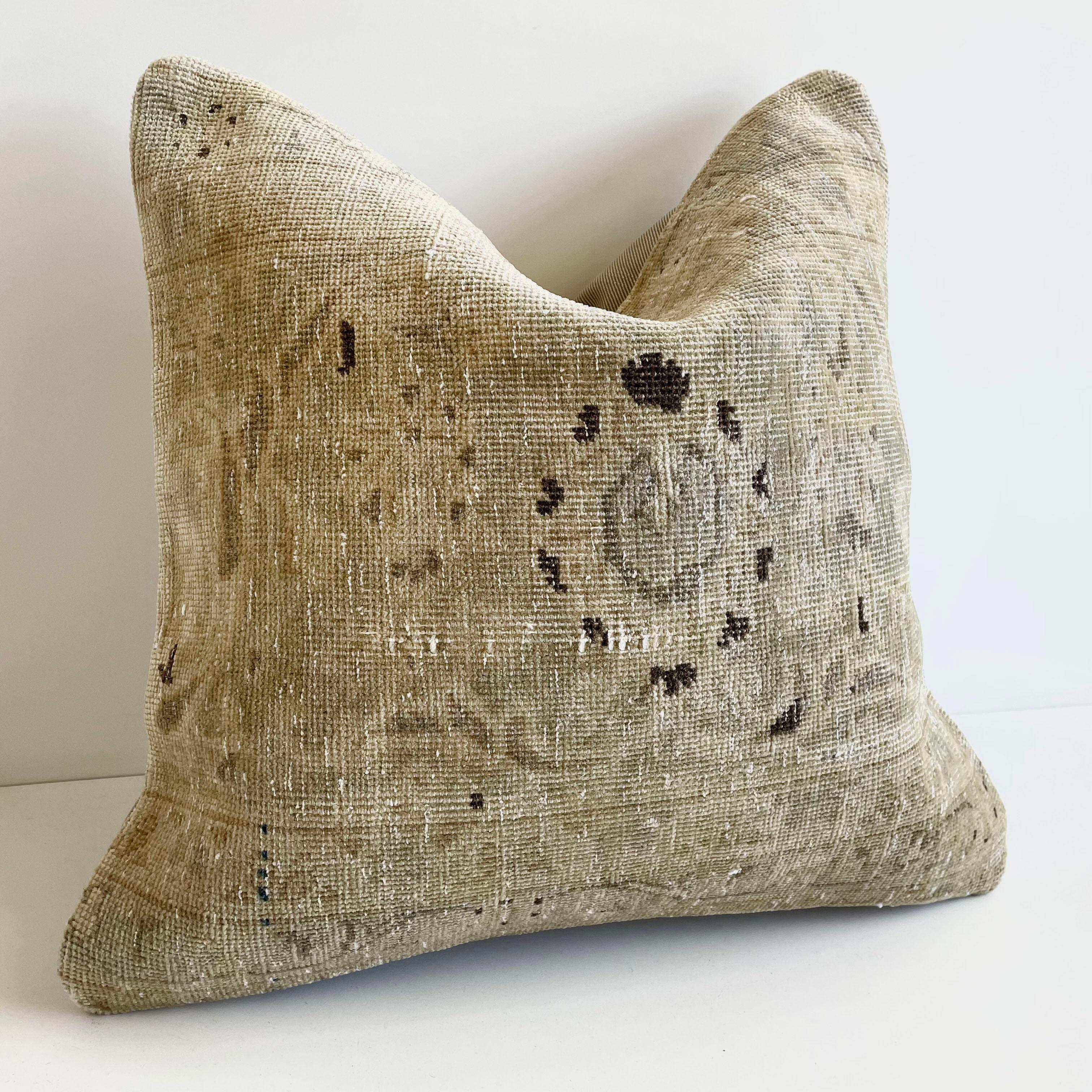 Antique woven rug pillow in natural gray brown and taupe with geometric patterns. The backside is a coordinating cotton. Our pillows are constructed with vintage one of a kind textiles from around the globe. Carefully constructed with the finest