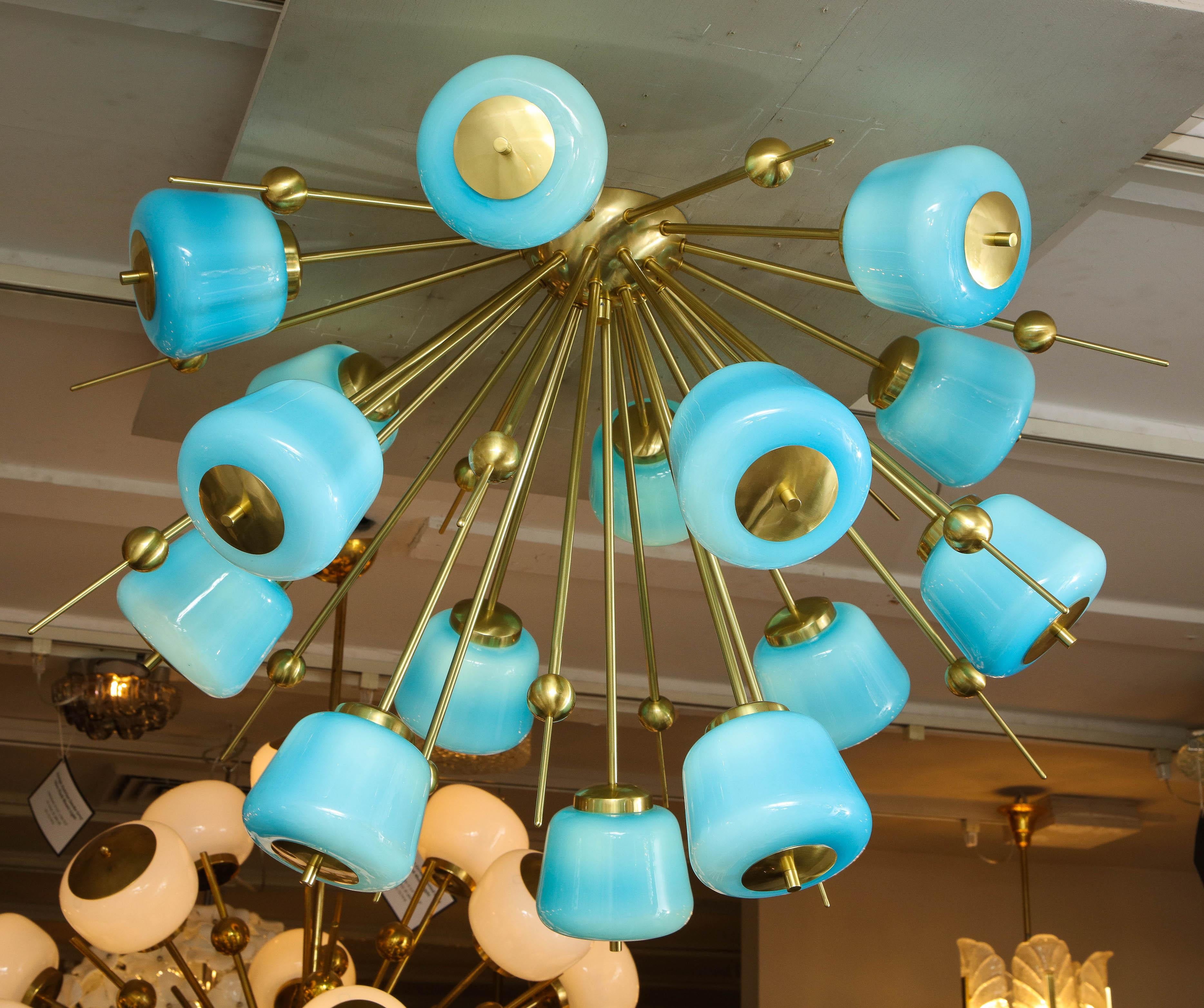 Custom turquoise milk glass flush mount chandelier in polished brass. Customization is available in different sizes, glass colors (white, sanded clear and turquoise) and finishes. G9 base light sockets are used for this chandelier. Please specify