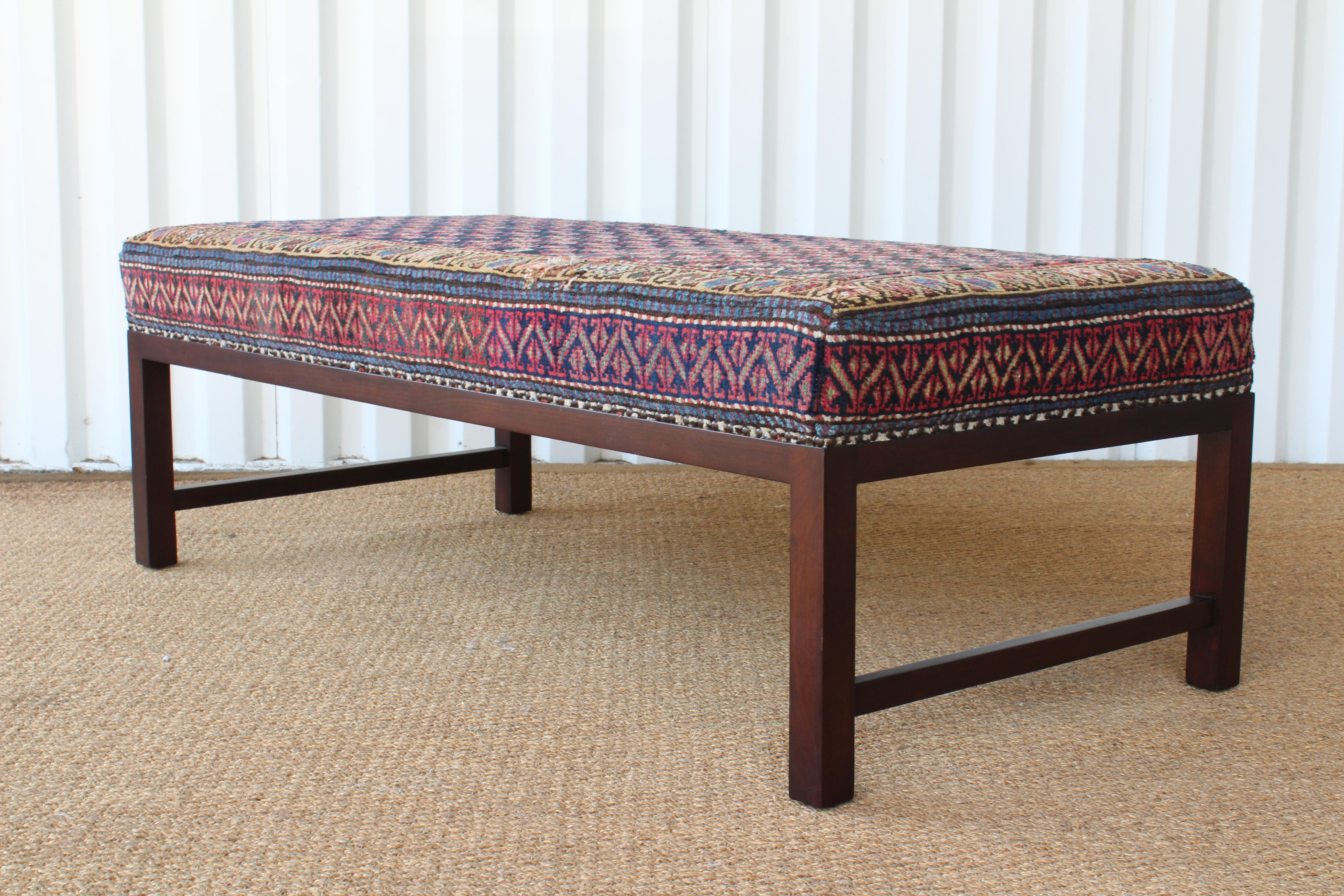 Custom made ottoman upholstered in a vintage Caucasian rug.