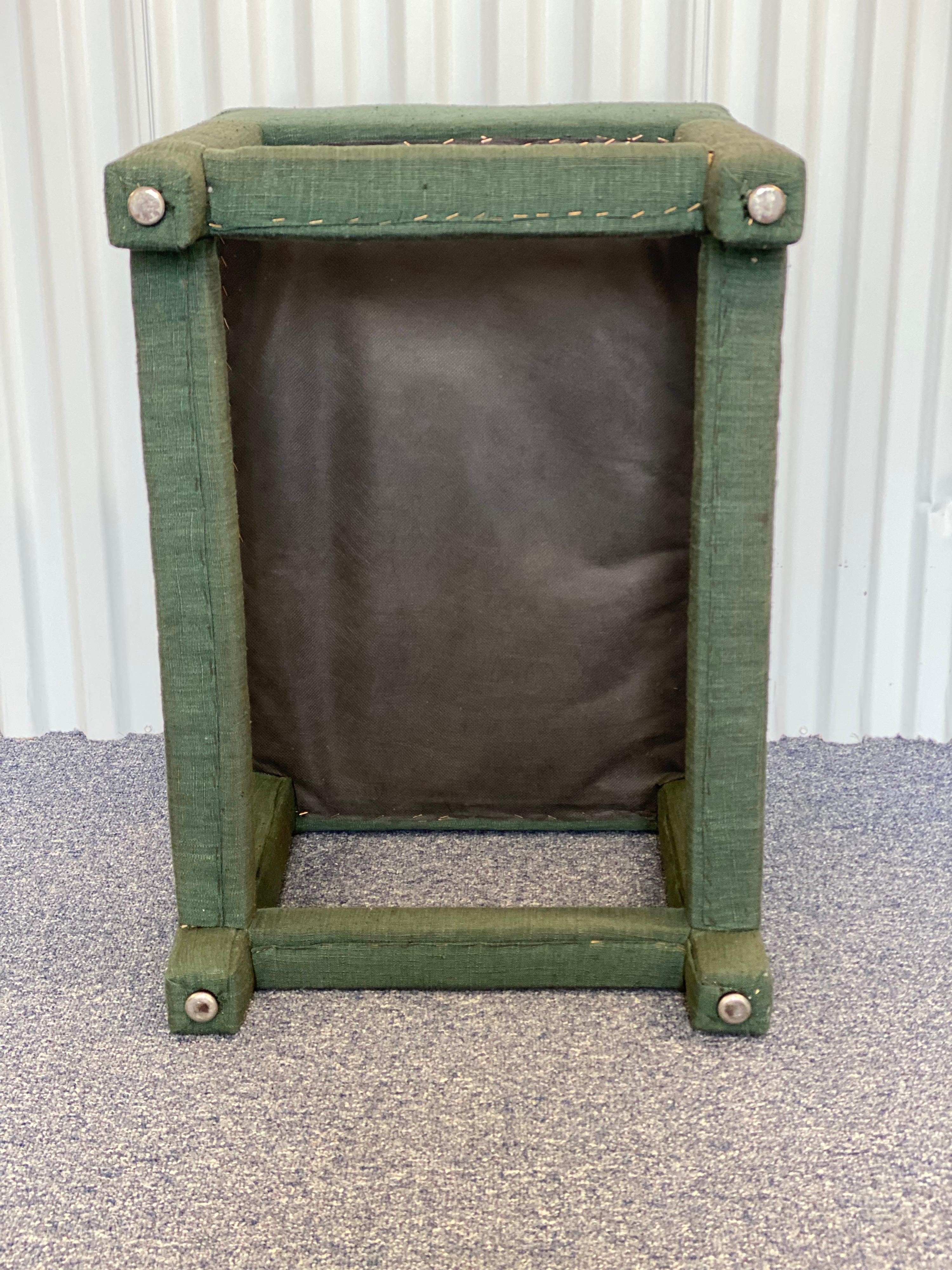 green upholstered stool