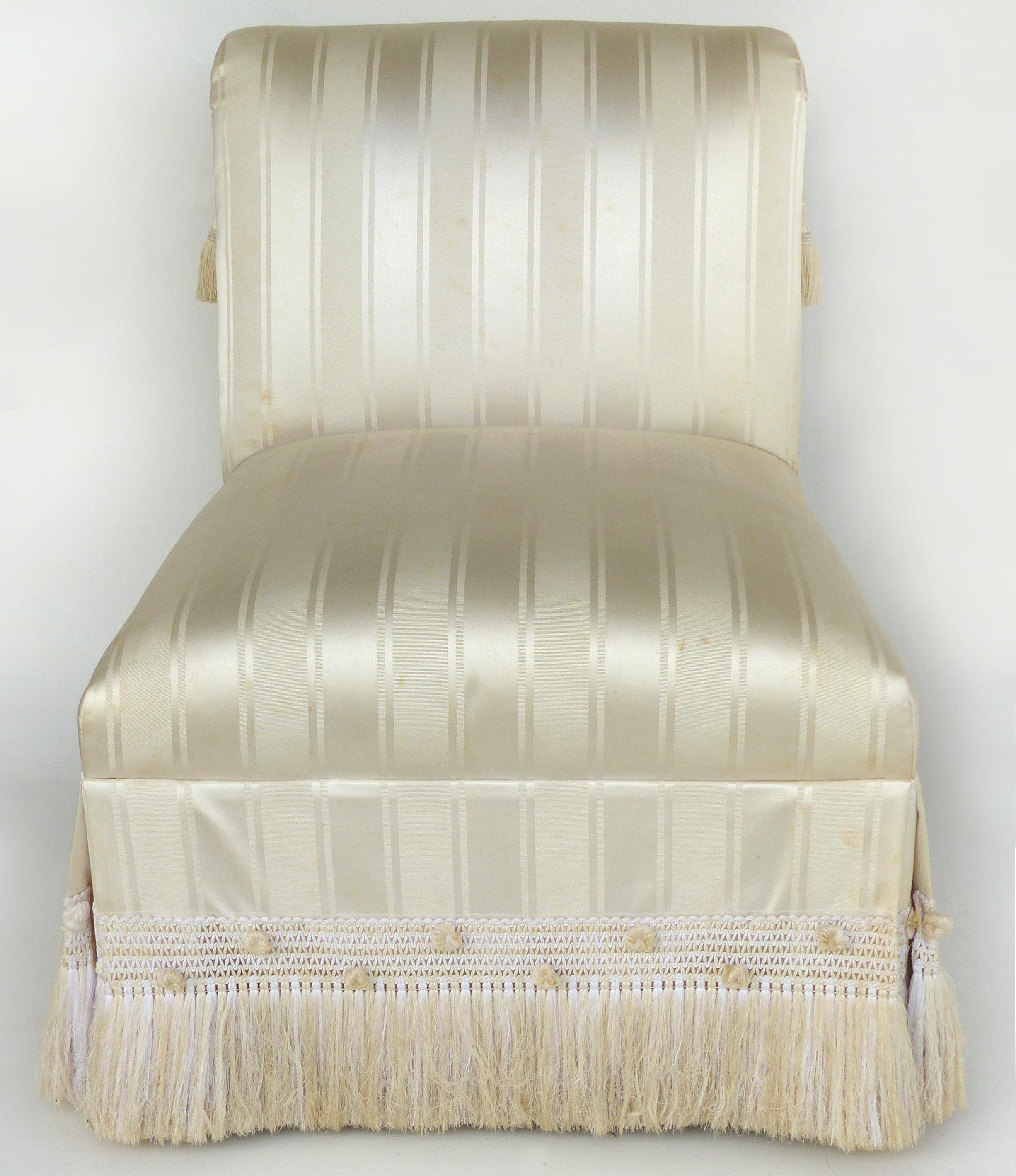 Custom Upholstered Slipper Chairs with Trim and Tassels, Pair

Offered for sale is a custom made pair of upholstered slipper chairs which require new upholstery. These elegant chairs have wonderful detailing but do show age wear to the stripped