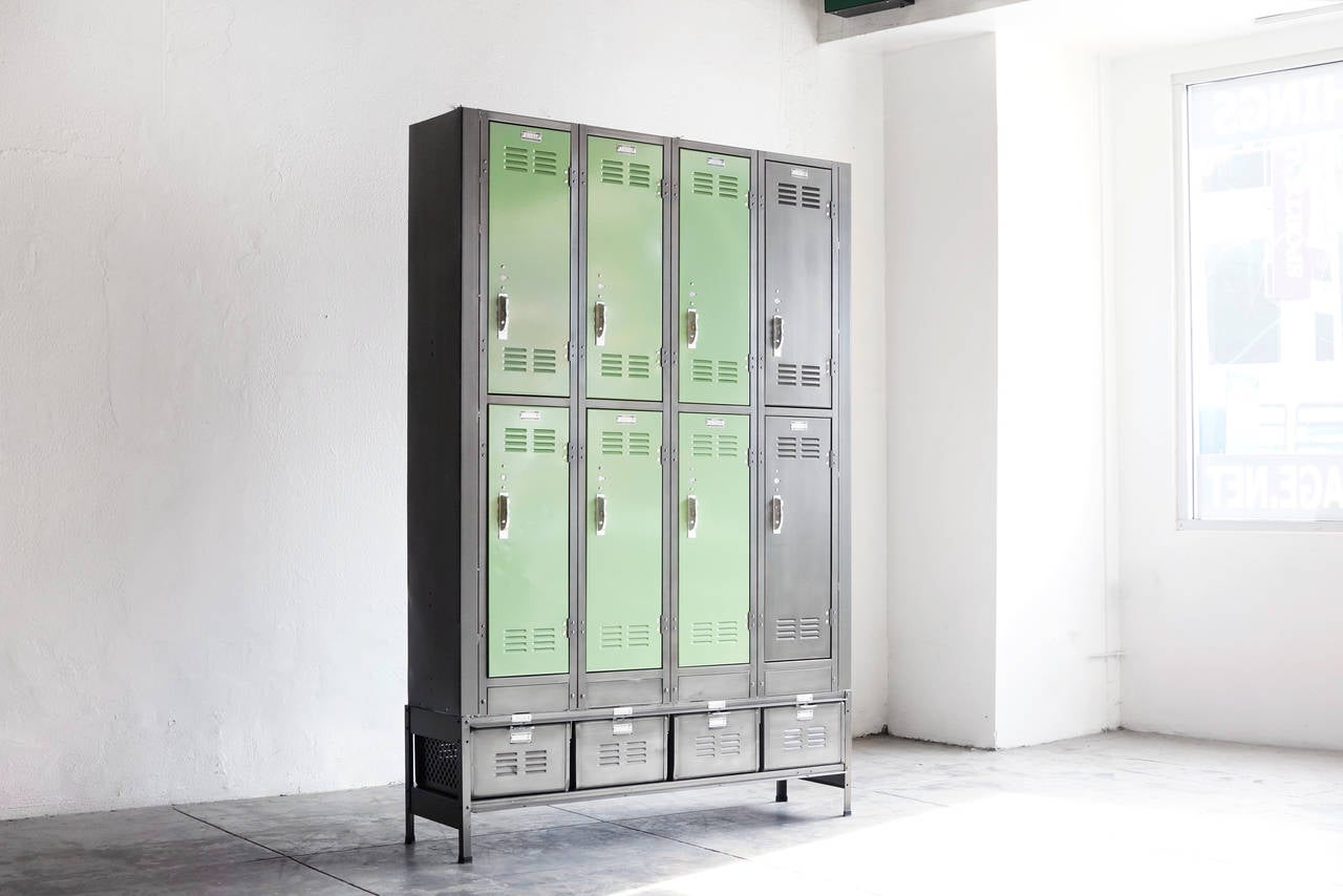 Our multi-locker storage unit is composed of newly fabricated lockers and baskets in a steel frame, finished with a custom powder-coat. Eight vertical lockers rest on four locker baskets for the ultimate maximized storage unit.

Featured here in