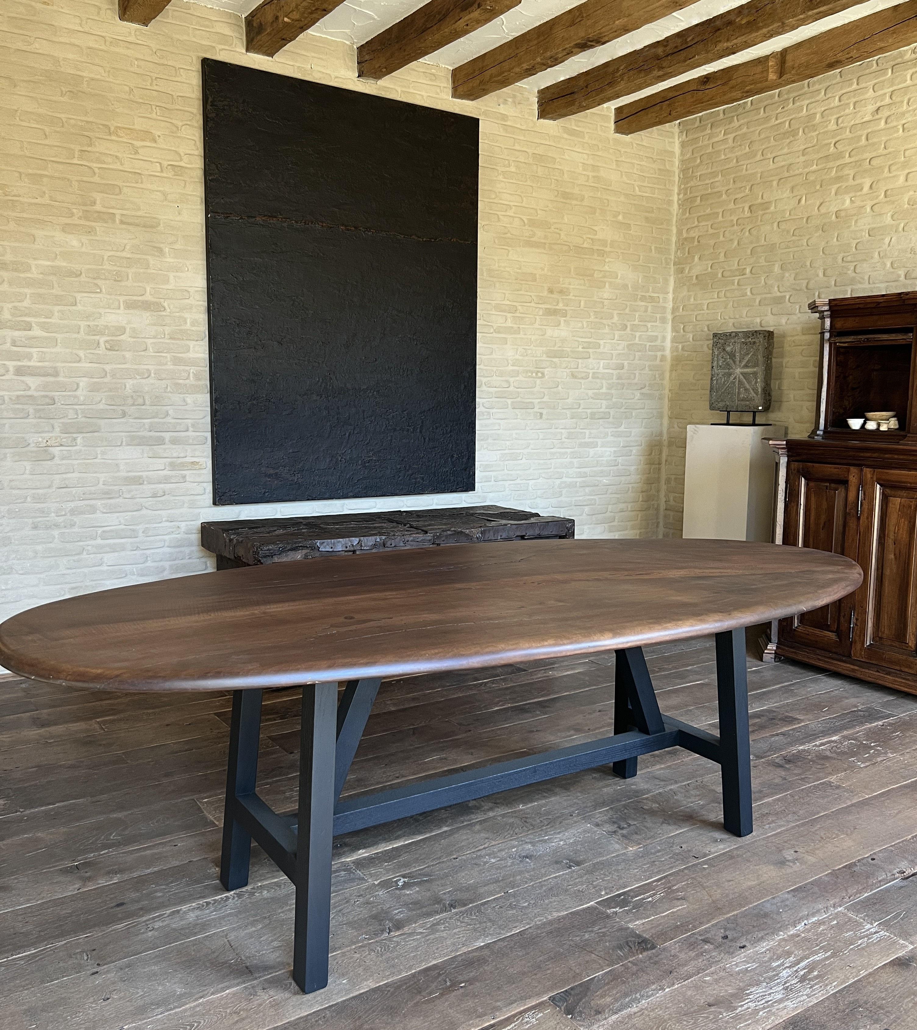 Our LUSI dining table is based on 17th and 18th century mountain trestle tables. The trestle base is manually assembled and proportioned following the golden cut. The 2 plank top is made from local walnut harvested out of 1 tree. The planks are