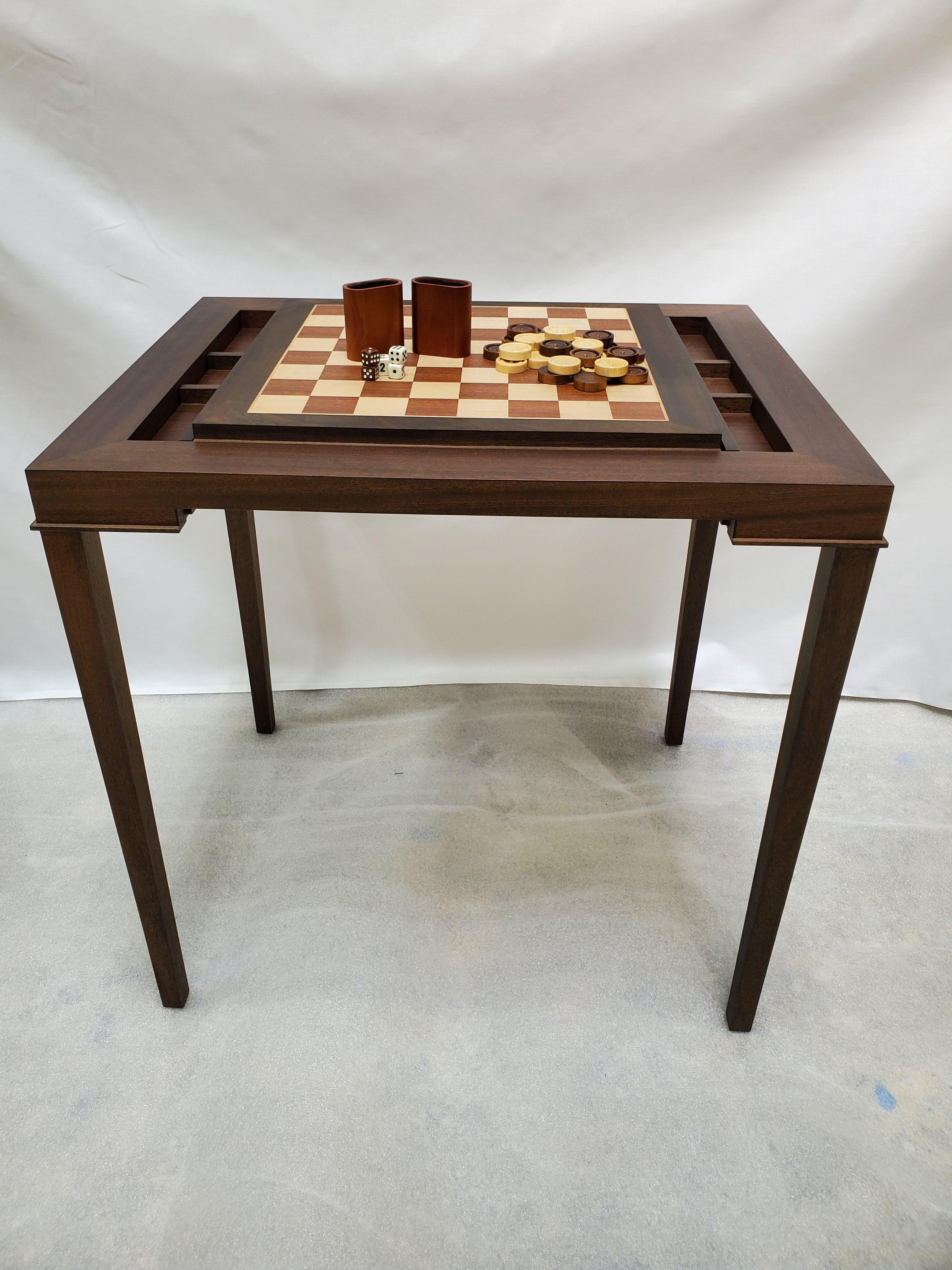 Custom walnut and mahogany backgammon table that converts to chess with a slide out board.

New production. Made to order in walnut and mahogany. Designed and made in NYC, each table is handcrafted within NYC and has unique attributes. One-day