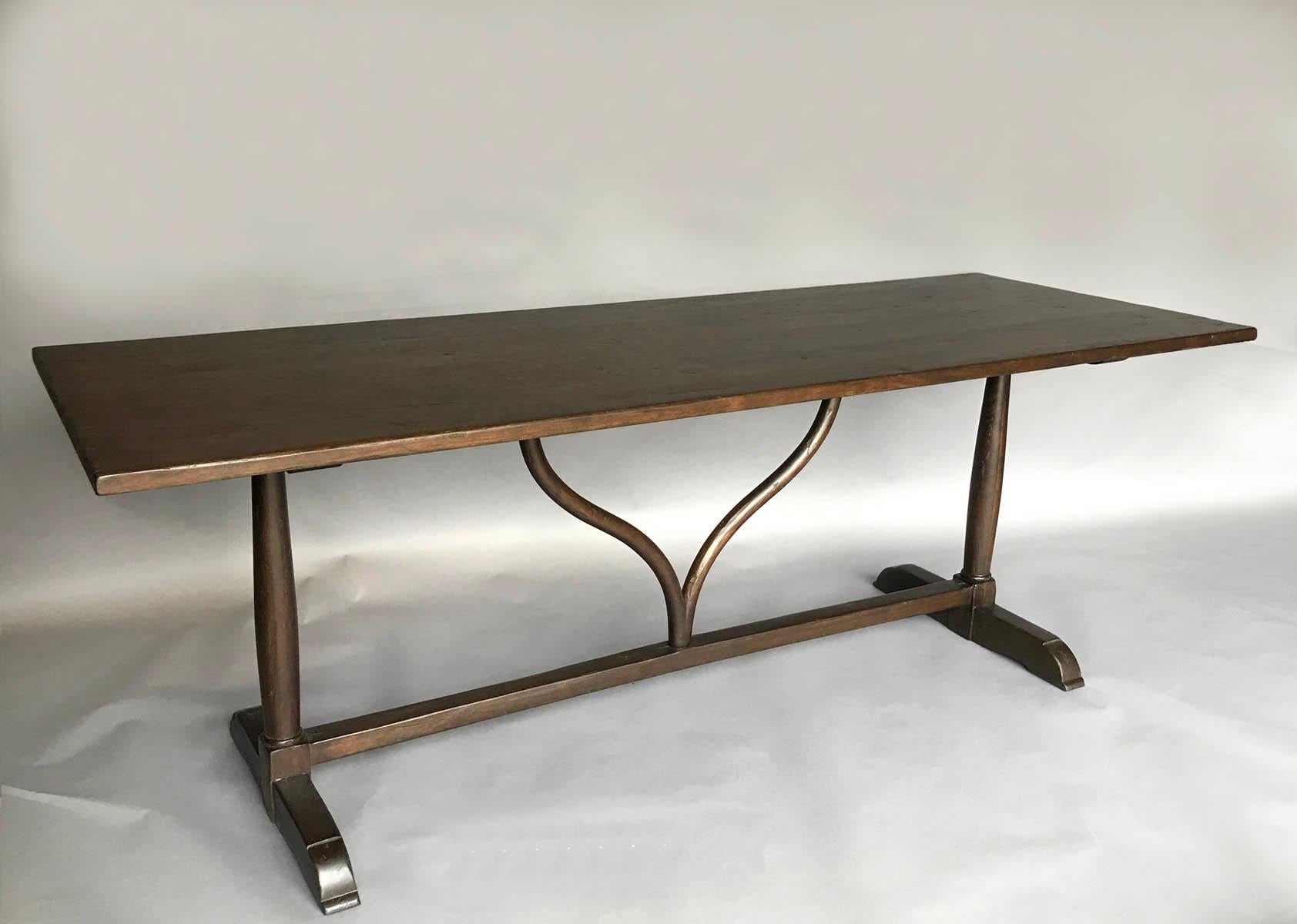 This is our custom wishbone winery table that can be made in any size and with any finish, in a range of colors and distresses. This particular table was going to be used as a desk so the wishbone stretcher is turned the same direction as the length