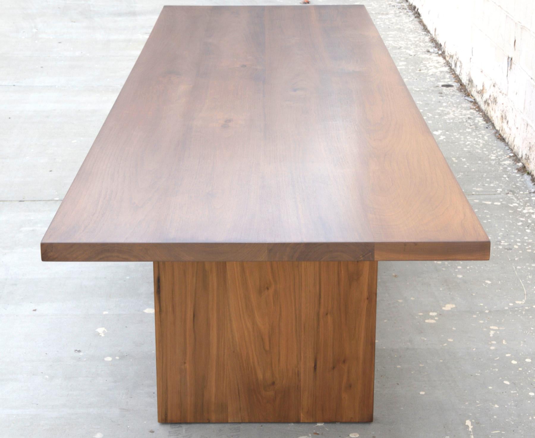 This modern walnut dining table is seen here in 132