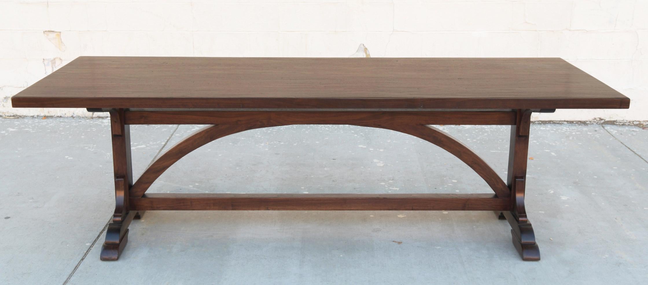 This walnut console dining table is seen here in 110