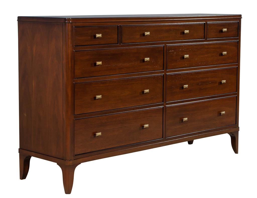This walnut chest is sleek in design and boasts a rich, deep brown finish. The top three solid wood dovetail are vanity style drawers are adorned with brushed brass drawer pulls. The perfect addition to any bedroom to be dressed up or down. All