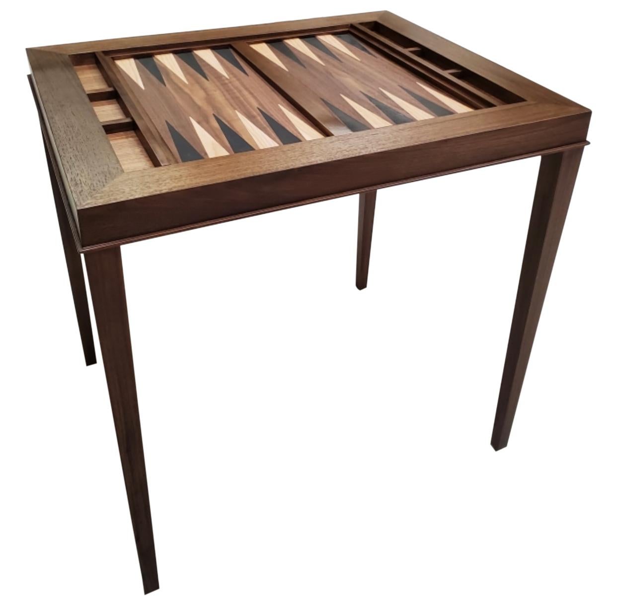 Custom walnut and mahogany backgammon table that converts to chess with a slide out board.

New production. Made to order in walnut and mahogany. Designed and made in NYC, each table is handcrafted within NYC and has unique attributes. One-day