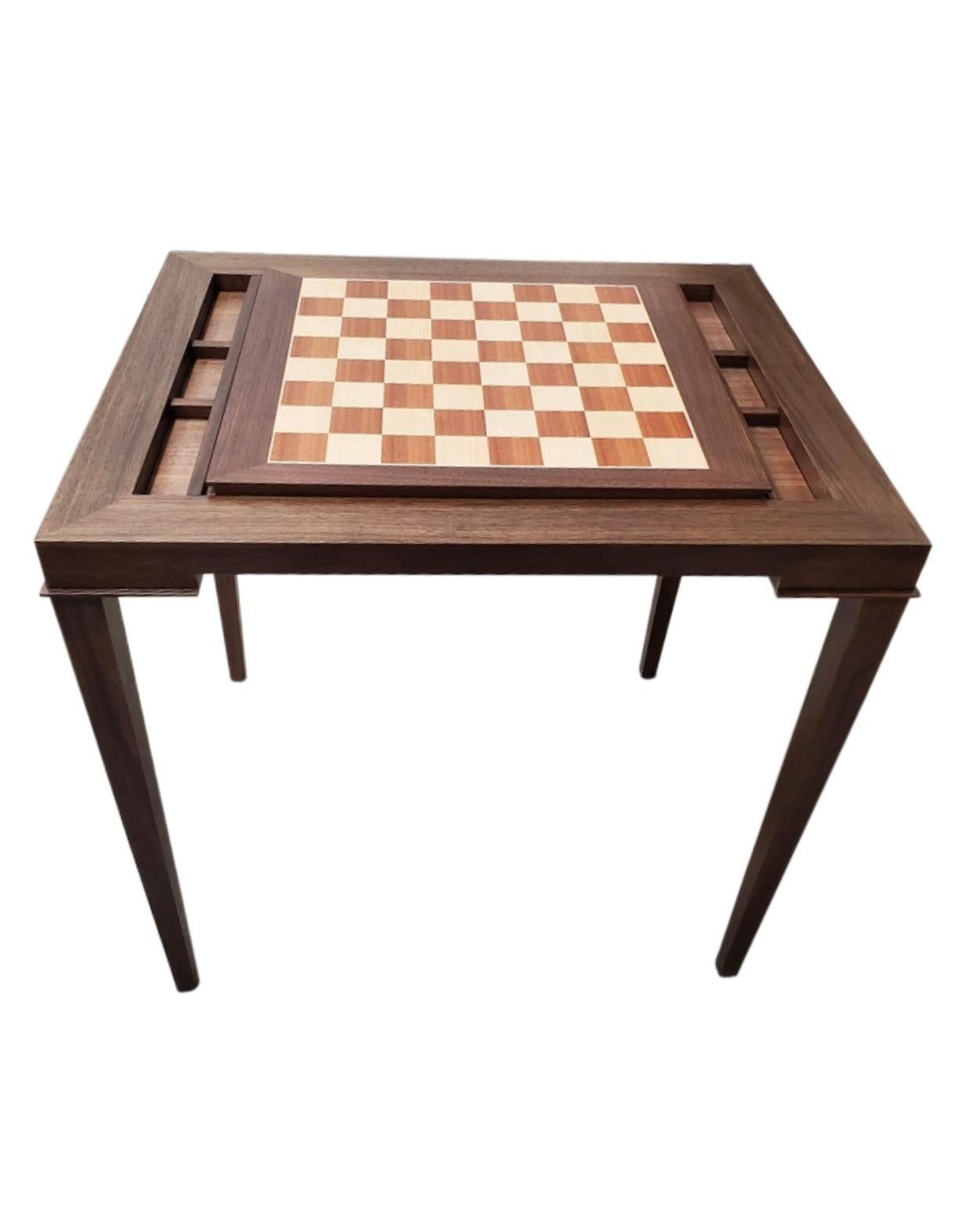 Custom walnut and mahogany backgammon table that converts to chess with a slide out board.

New production. Made to order in walnut and mahogany. Designed and made in NYC, each table is handcrafted within NYC and has unique attributes. One-day