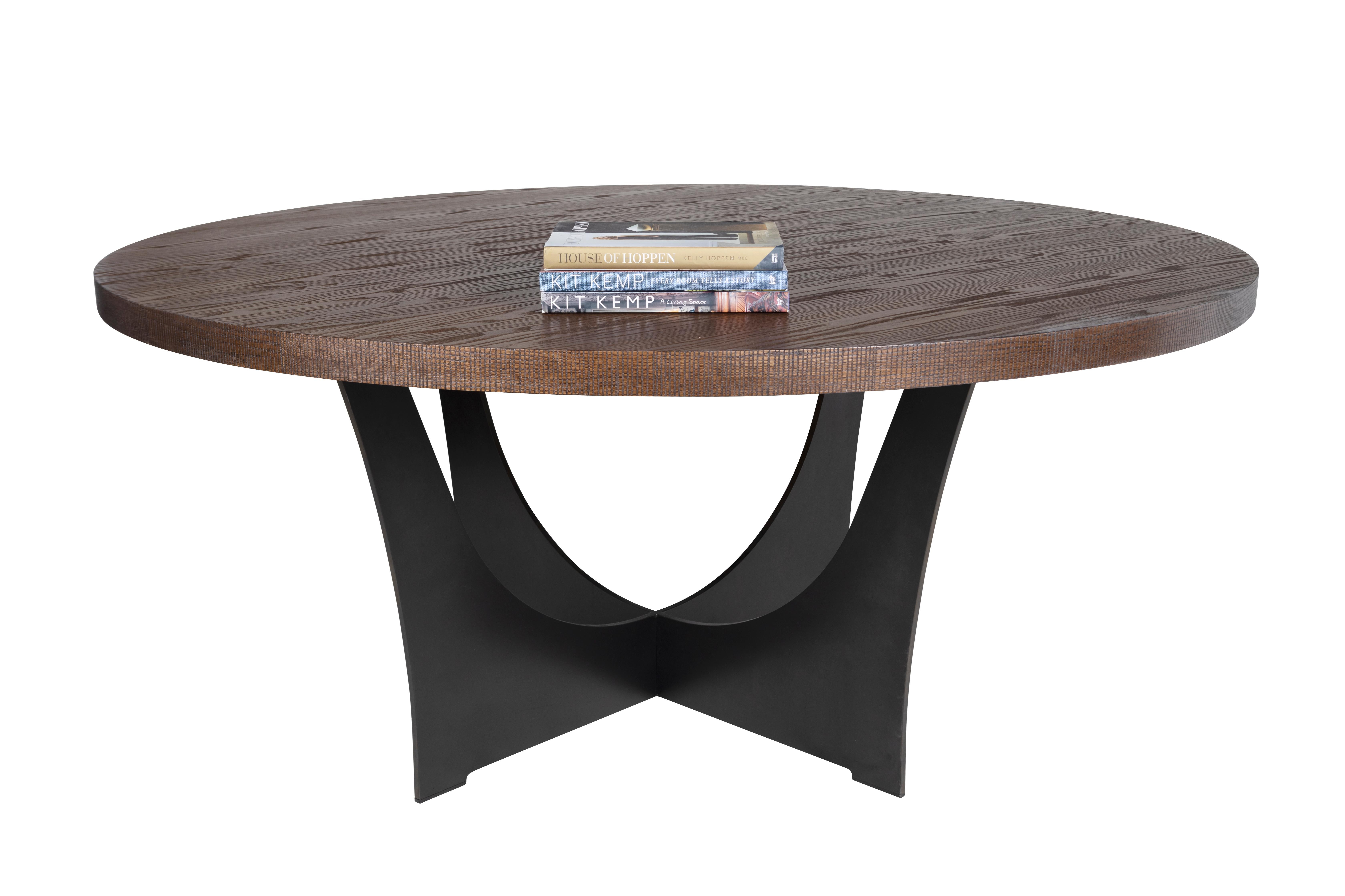 Custom oak dining table with walnut finish. Distressed coin edging resting on a ebonized steel base.

Designed by Brendan Bass for the Vision and Design Collection, by using high quality materials and textures. All materials are sourced from local