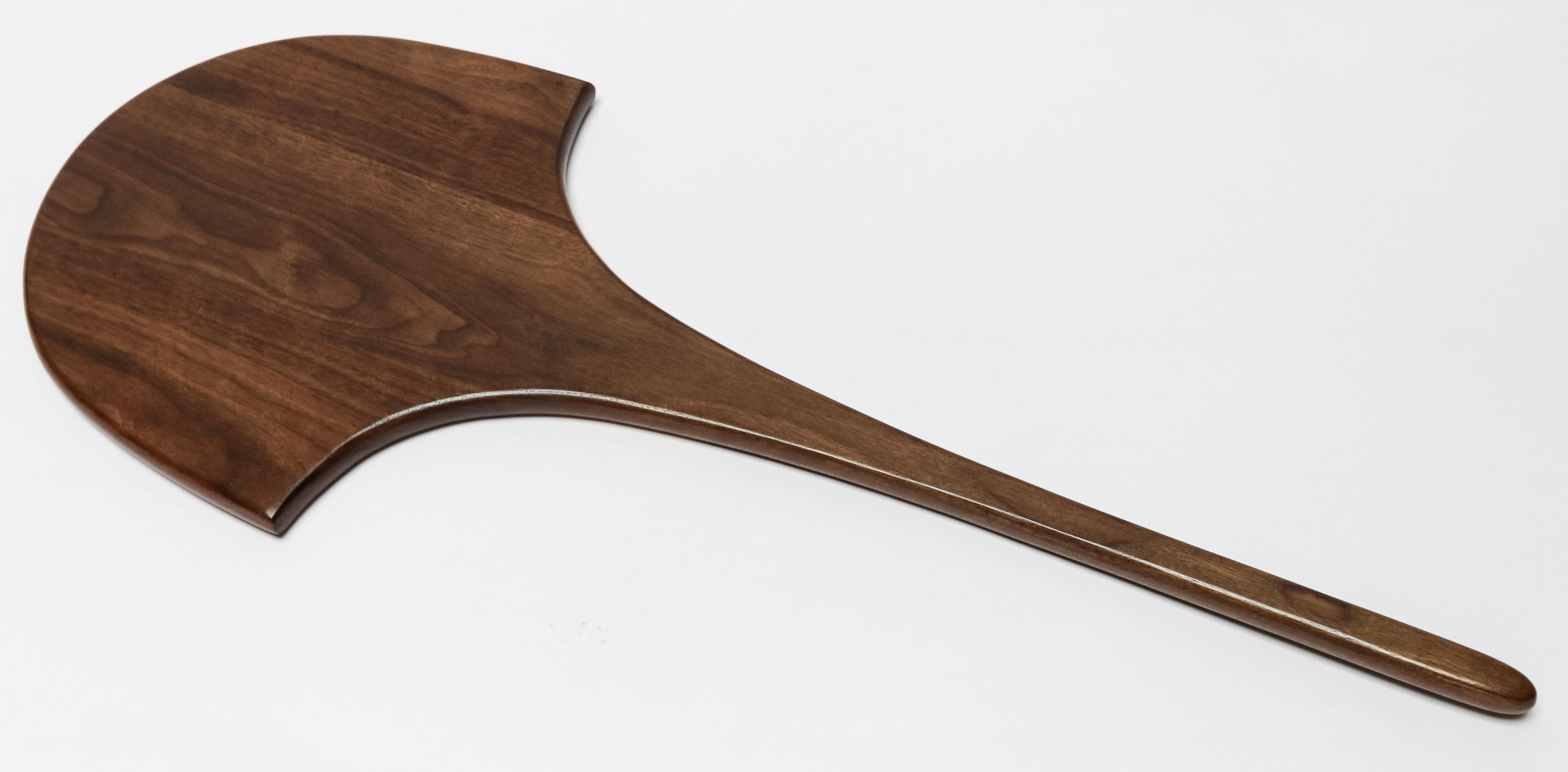 Custom walnut serving board with long handle by Adesso Imports. Can be done in different sizes and woods.