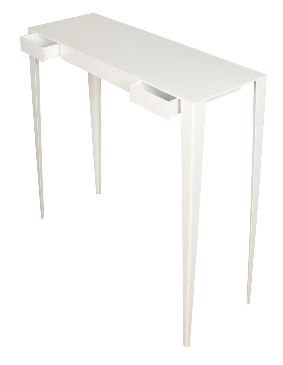 Custom white metal console table or desk in modern style with legs that taper to a narrow shape at the base. Table has two drawers.