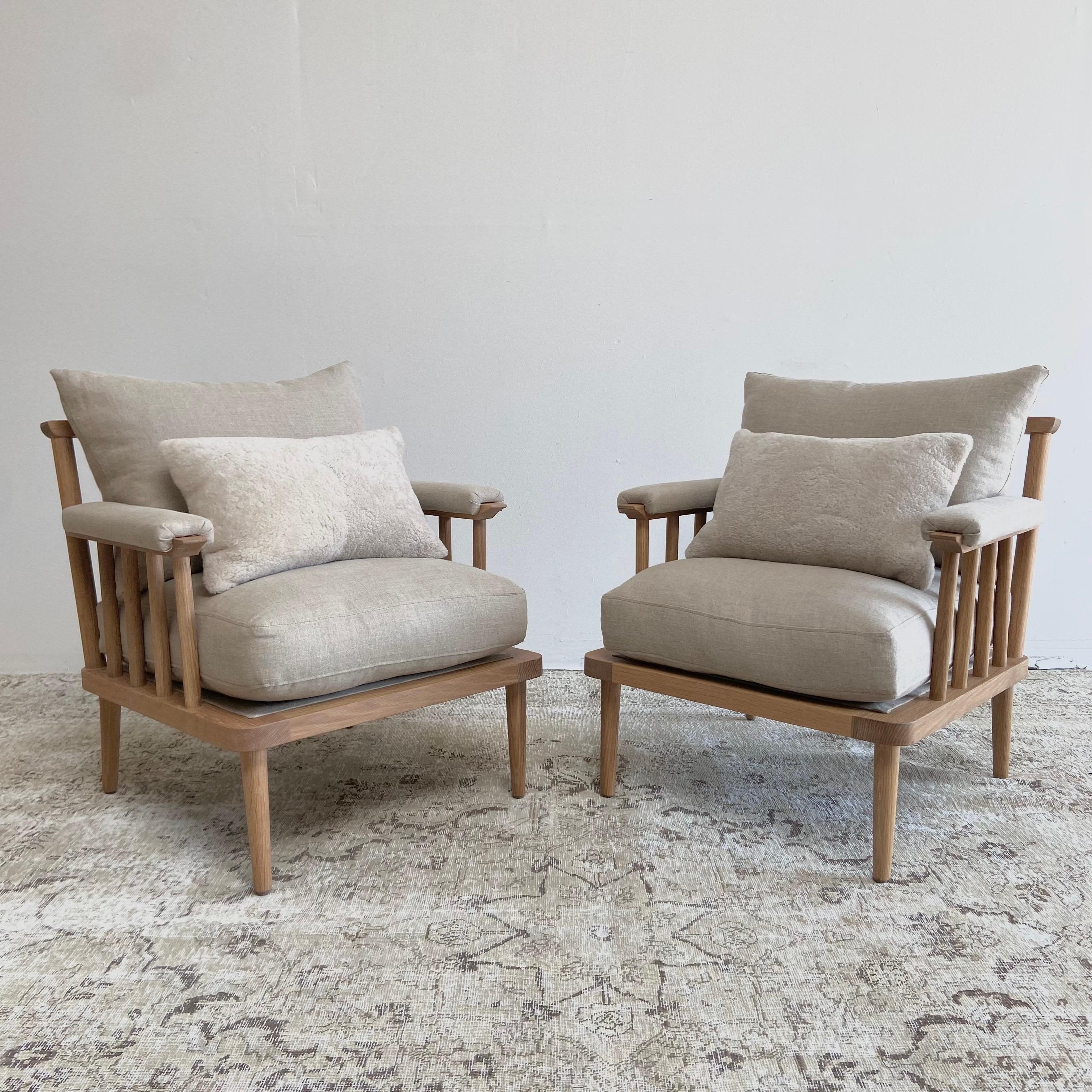 Our custom white oak chair has a natural finish we call Mist 5. This enhances the white oak giving it a subtle lighter appearance. We offer this in all our custom finishes, and fabrics. 
Choose from our 20 different linen colors, sheep skins,